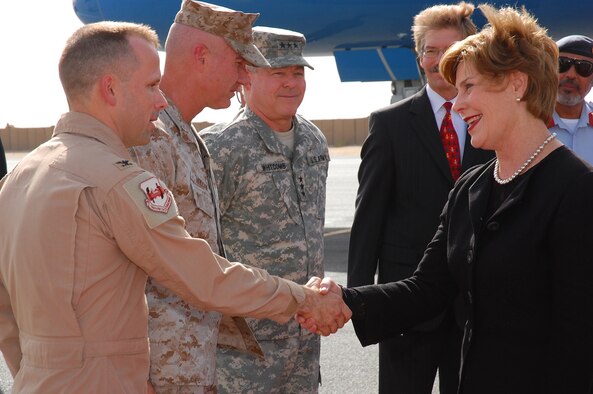 SOUTHWEST ASIA -- First Lady Laura Bush greets Col. Brian O'Connor, 386th Air Expeditionary Wing vice commander, Oct. 24 at an undisclosed location. The first lady's visit highlights the accomplishments of the Middle East partnership initiative programs of the state department and also to visit a number of programs in countries that have launched the United States and Middle East Partnership for Breast Cancer Awareness and Research.  (U.S. Air Force photo by Staff Sgt. Tia Schroeder)