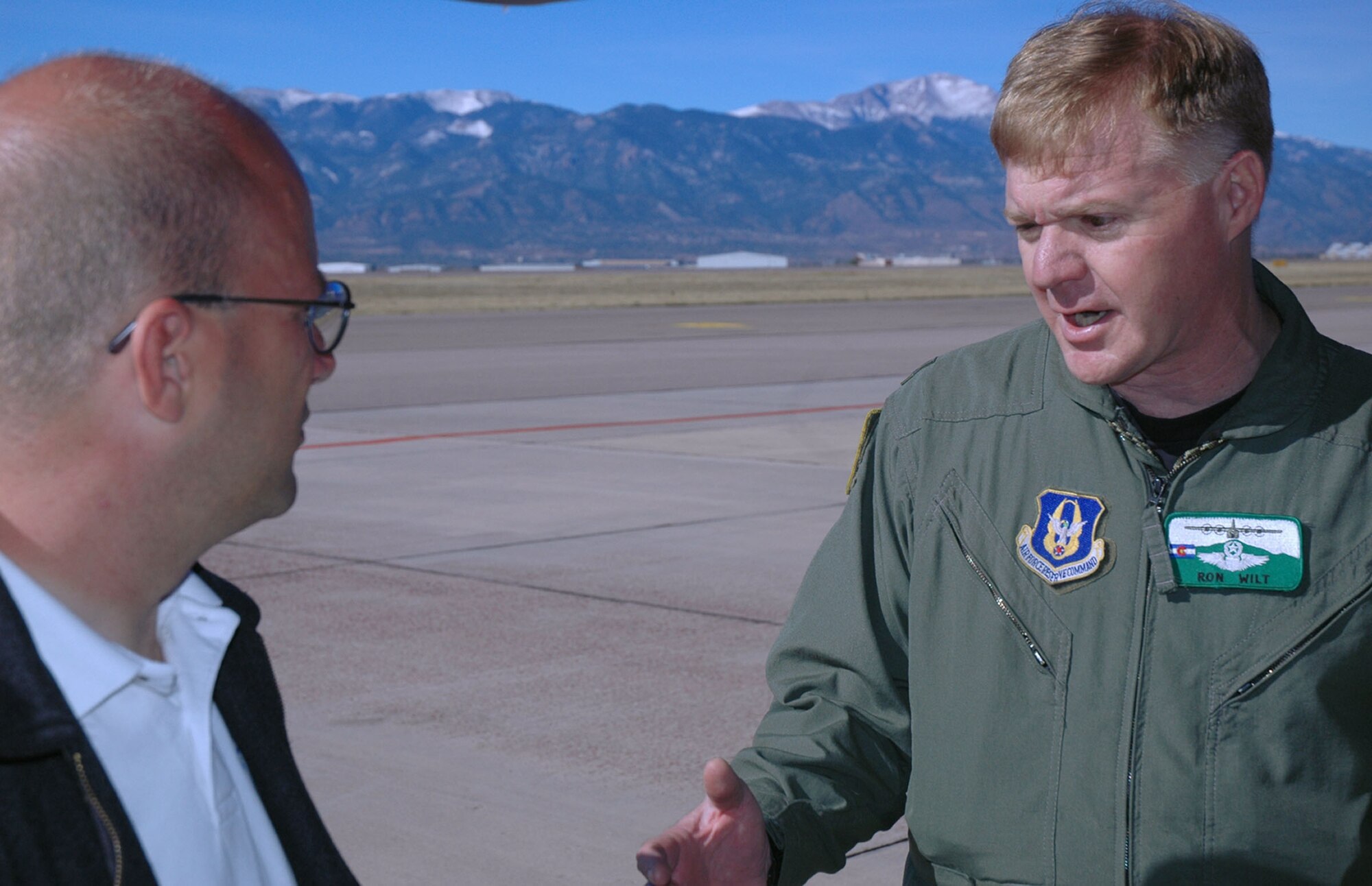 Lt. Col. Ron Wilt, 302nd Operations Group deputy commander, explains intricacies involved with the Modular Airborne Firefighting Mission to a member of the Colorado Springs, Colo., media.  Colonel Wilt was one of 30 Reservists who departed Peterson Air Force Base, Colo., Oct. 23 for southern California to assist in battling raging wildfires that have forced thousand of residents to evacuate their homes for safety and shelter. (U.S. Air Force photo/Maj. James R. Wilson)