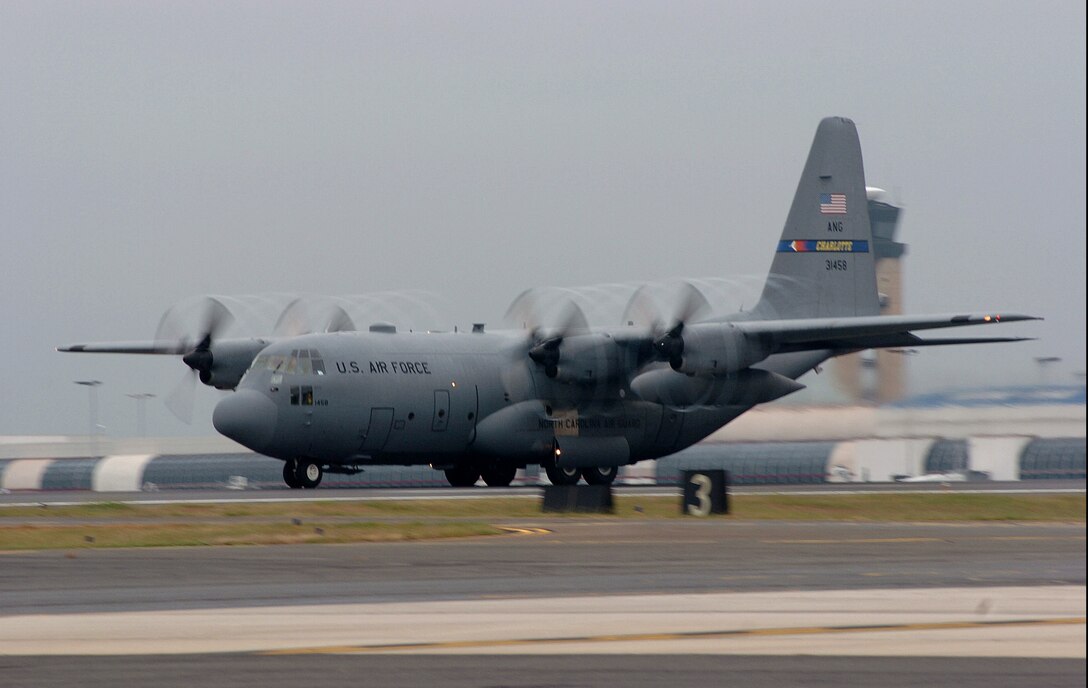 A U.S. Air Force C-130 Hercules aircraft from the 145th Airlift Wing, North Carolina Air National Guard, takes off Oct. 23, 2007, from Charlotte-Douglas International Airport, N.C. The North Carolina Air National Guard has deployed three C-130s, flight crews and support personnel to Port Hueneme/Channel Islands, Calif., to assist the U.S. Forest Service in firefighting efforts to contain, control and extinguish wild fires. The aircraft will utilize the Modular Airborne Fire Fighting System, which is a fire fighting apparatus that is loaded into the aircraft\'s cargo area and consists of a series of pressurized tanks that hold 3,000 gallons of flame-retardant liquid called Phos-Chek.