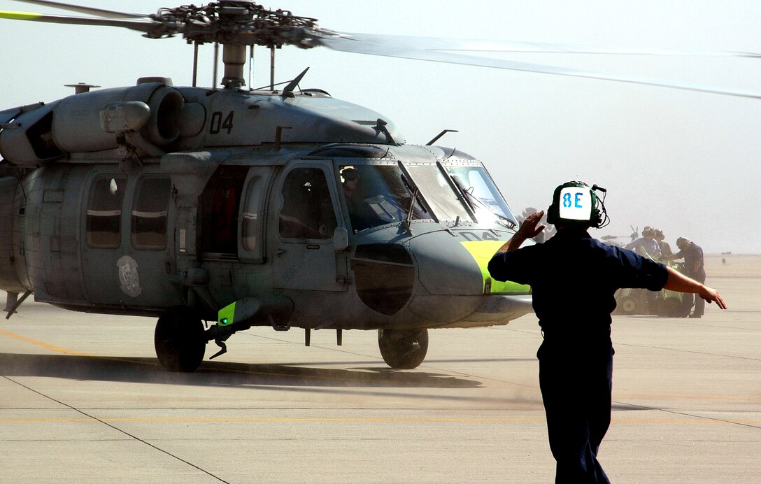 A U.S. Navy plane captain from Helicopter Sea Combat Squadron Eight