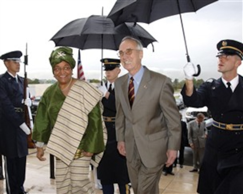 Deputy Secretary of Defense Gordon England escorts Liberian President Ellen Johnson-Sirleaf into the Pentagon on Oct. 24, 2007, for discussions on a broad range of bilateral security issues.  