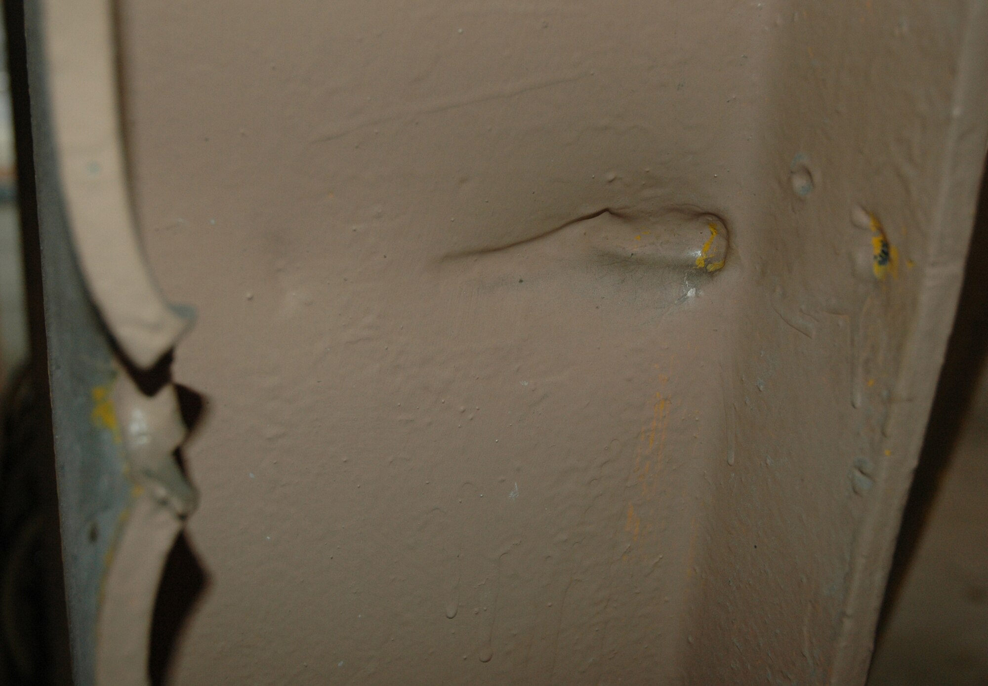 The massive steel supports of the maintenance hangars at Hickam Air Force Base, Hawaii, are the witnesses to history, as shown by the gouges and holes seen here. On Dec. 7, 1941, the Japanese attacked Pearl Harbor, launching the U.S. into World War II. The remnants of that attack, seen here. are carefully preserved. The 940th Maintenance Group sent 35 members from Sept. 14-28 to assist the 154th Maintenance Squadron, Hawaii Air National Guard, with maintenance on their fleet of KC-135s and the new C-17s assigned to the active duty. The Guard works daily inside the World War II hangars which have been preserved. (US Air Force photo/Master Sgt Ellen L Hatfield