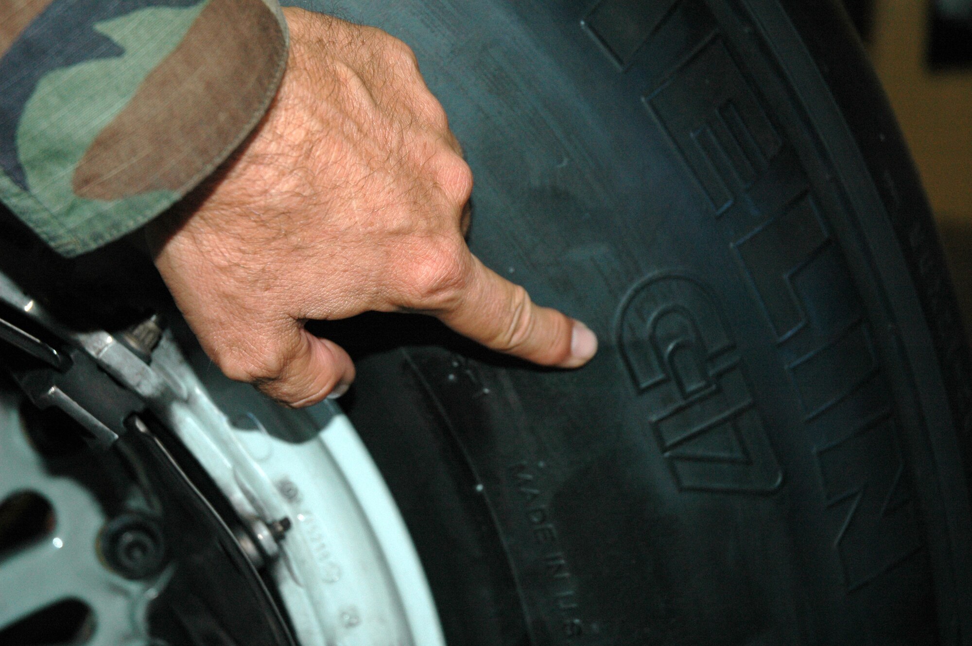 There's no mistaking what aircraft this tire fits, as pointed out by Master Sgt Ralph Martinez, 940th Maintenance Group quality assurance technician. Sergeant Martinez was examining racks of aircraft tires in the hangars that house the 154th Maintenance Squadron, Hawaii Air National Guard, Hickam Air Force Base. The 940th MXG spent from Sept. 14-28 on duty with the Guard unit, performing maintenance on their KC-135s and the active duty's new C-17s. (US Air Force photo/Master Sgt Ellen L Hatfield)