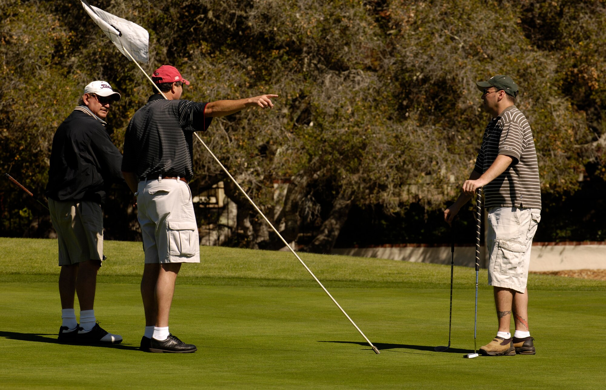 Dan Contreras, Greg Doyle, and Master Sgt. Richard Cassidy, 30th Space Wing Public Affairs, participate in the Big V Golf Tournament on October 19. The Big V Golf Tournament was hosted and paid for by the local community to show support for military members stationed at Vandenberg Air Force Base. (Photo by Airman 1st Class Christian Thomas)