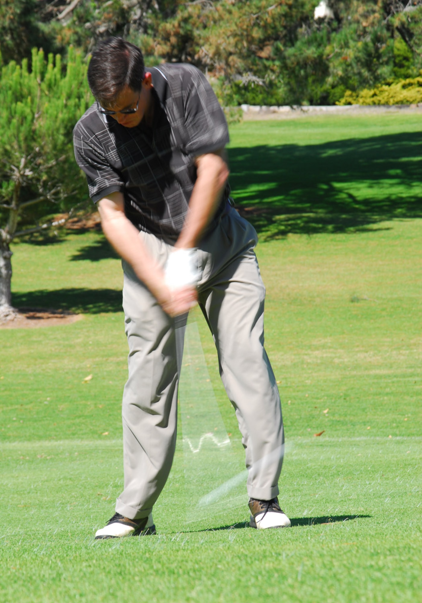 Col. Steve Tanous, 30th Space Wing Commander, strikes the ball on the first tee during the Big V golf tournament at the Village Country Club in Vandenberg Village, Oct. 19. The event was hosted and paid for by the local community to support the military troops. (Photo by Airman 1st Class Ashley Tyler)