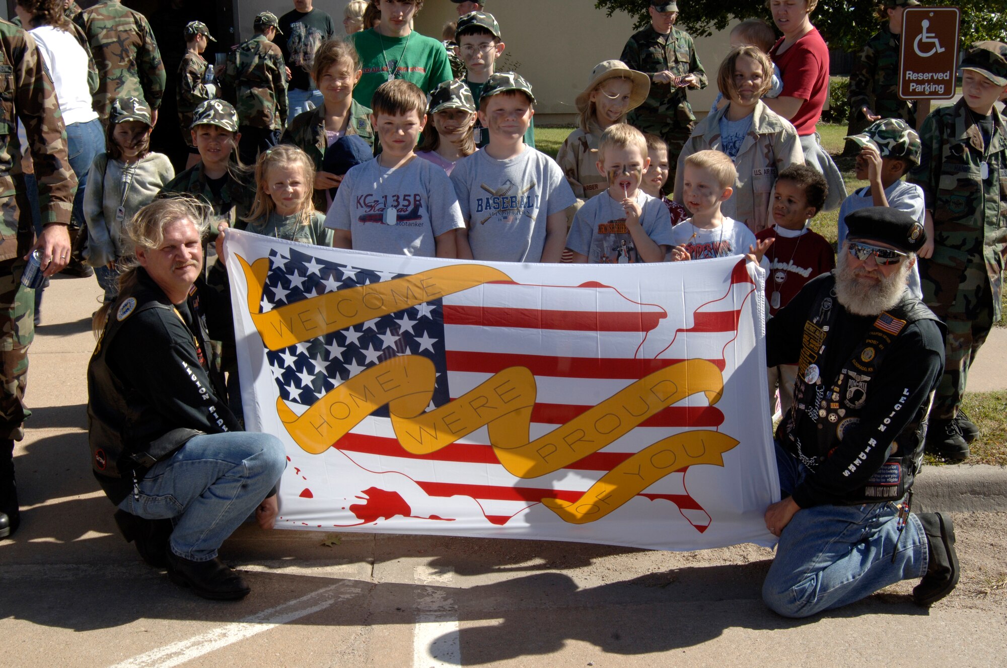 MCCONNELL AIR FORCE BASE, Kan. -- The American Legion Riders show their support for military members, by welcoming back the children from a mock deployment at the Kids Deployment Line, Oct. 20. The American Legion Riders escorted the buses of children around the base in a motorcade before returning with them to the Airmen and Family Readiness Center for a “welcome home.” (Photo by Airman 1st Class Justin Shelton)