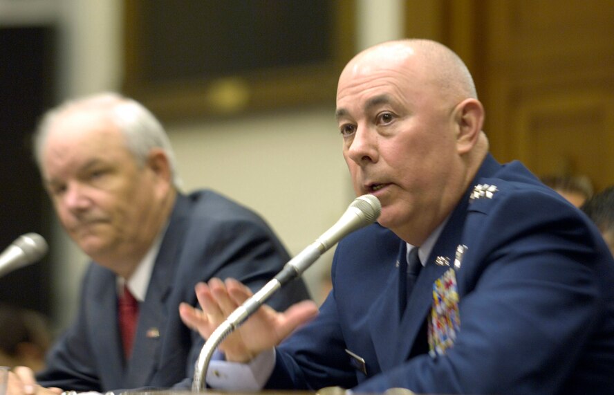 Secretary of the Air Force Michael W. Wynne (left) looks on as Air Force Chief of Staff Gen. T. Michael Moseley answers a question during a hearing of the House Armed Services Committee Oct. 24 in Washington. The Air Force senior leaders were on Capitol Hill to discuss Air Force strategic initiatives with congressional members. (U.S. Air Force photo/Master Sgt. Jim Varhegyi)