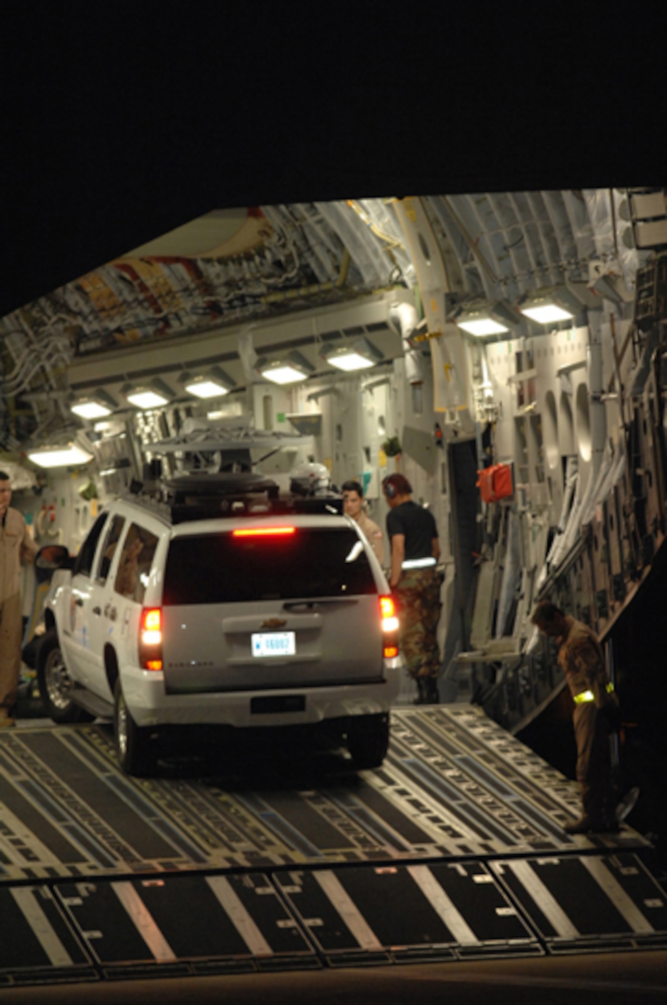 Air Force reservists from the 452nd Air Mobility Wing assist the U.S. Army North from Fort Sam in Houston, Texas, unload emergency response equipment from an Air Force Reserve Command C-17 Globemaster III aircraft at March Air Reserve Base, Calif., Oct. 24, 2007. The U.S. Army North is assisting with Southern California wildfires by managing and aiding all the Department of Defense forces involved. (U.S. Air Force photo/Staff Sgt. Hector Garcia)