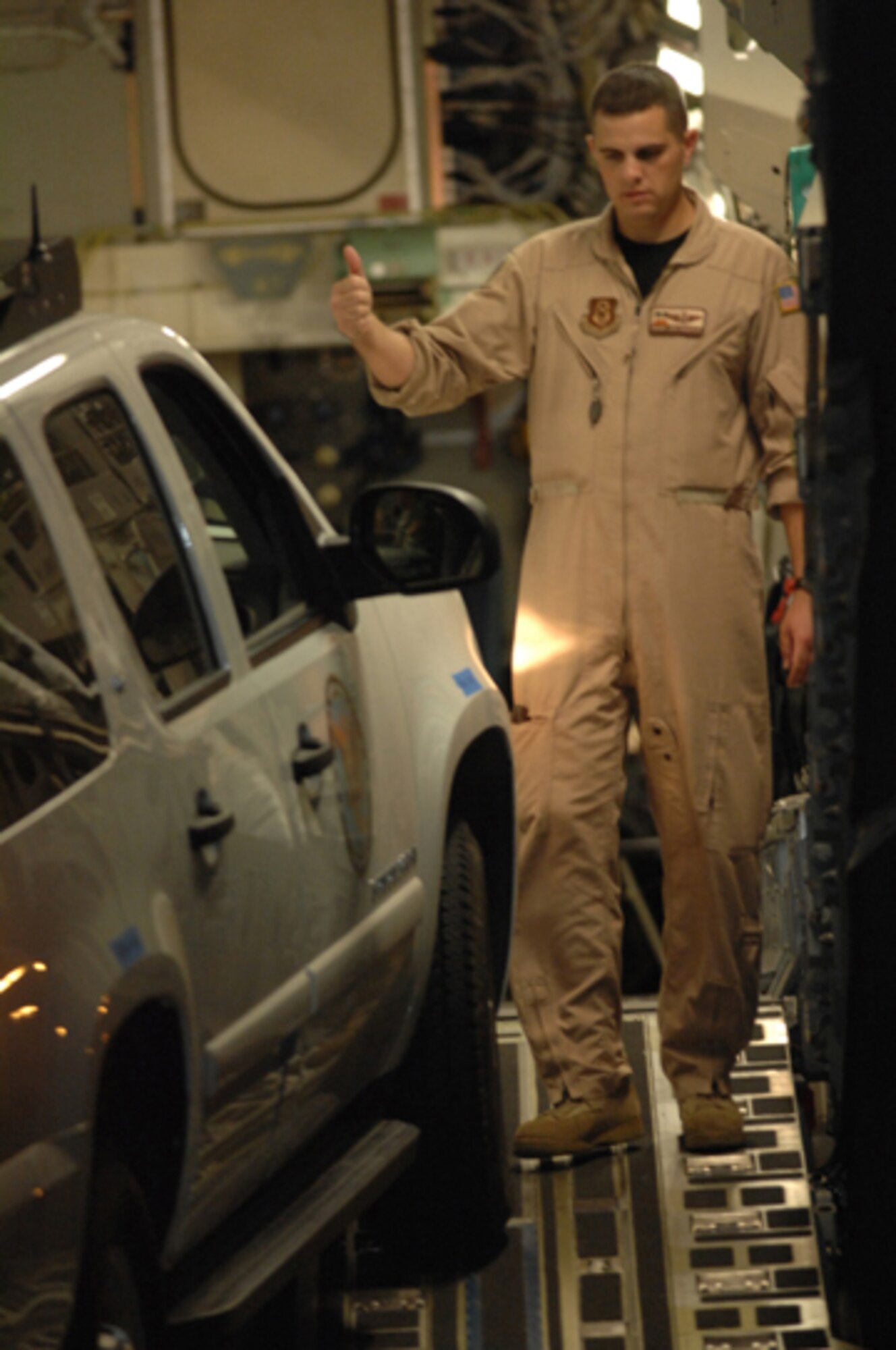 Master Sgt. Jim Madrid, an Air Force reservist from the 729th Airlift Squadron, assists the U.S. Army North from Fort Sam in Houston, Texas, unload emergency response equipment from a C-17 Globemaster III aircraft at March Air Reserve Base, Calif., Oct. 24, 2007. (U.S. Air Force photo/Staff Sgt. Hector Garcia)