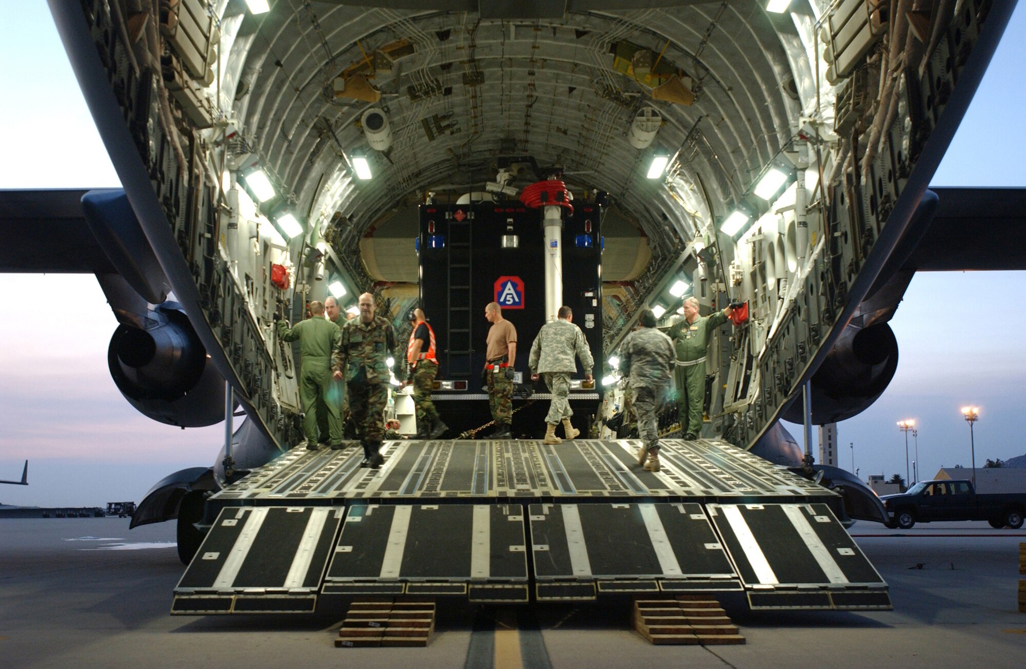 Air Force reservists from the 452nd Air Mobility Wing assist the U.S. Army North from Fort Sam in Houston, Texas, unload emergency response equipment from a C-17 Globemaster III aircraft at March Air Reserve Base, Calif., Oct. 24, 2007. The U.S. Army North is assisting with Southern California wildfires by managing and aiding all Defense Department forces involved. (U.S. Air Force photo/Senior Airman Daniel St. Pierre)