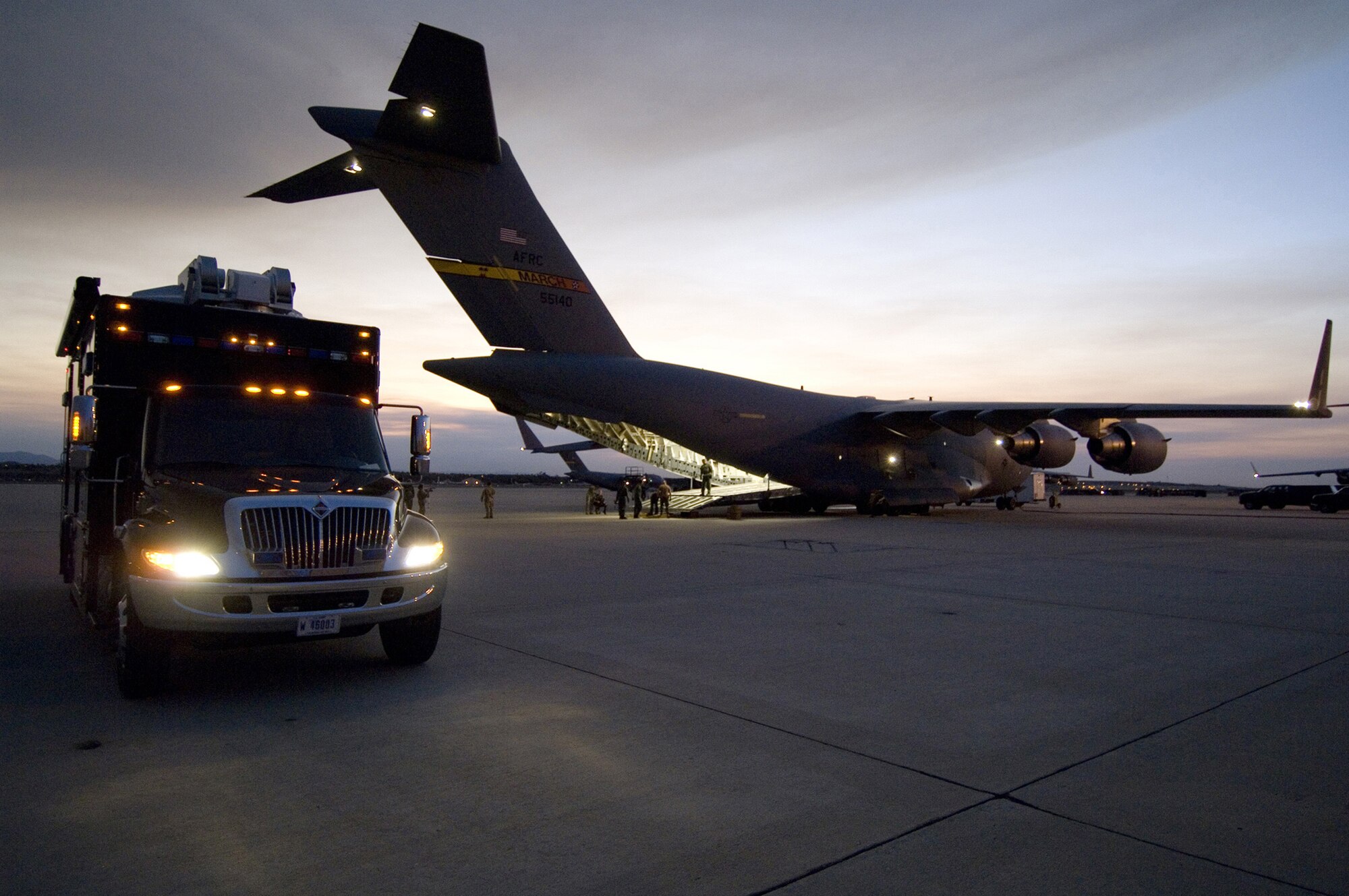 U.S. Army equipment is unloaded from an Air Force Reserve Command C-17 Globemaster III aircraft from the 452nd Air Mobility Wing at March Air Force Base, Calif., Oct. 24, 2007. The equipment is part of a federal support package used to assist federal, state and local agencies responding to the California wildfires. (U.S. Navy photo/Mass Communication Specialist 1st Class Troy Latham)