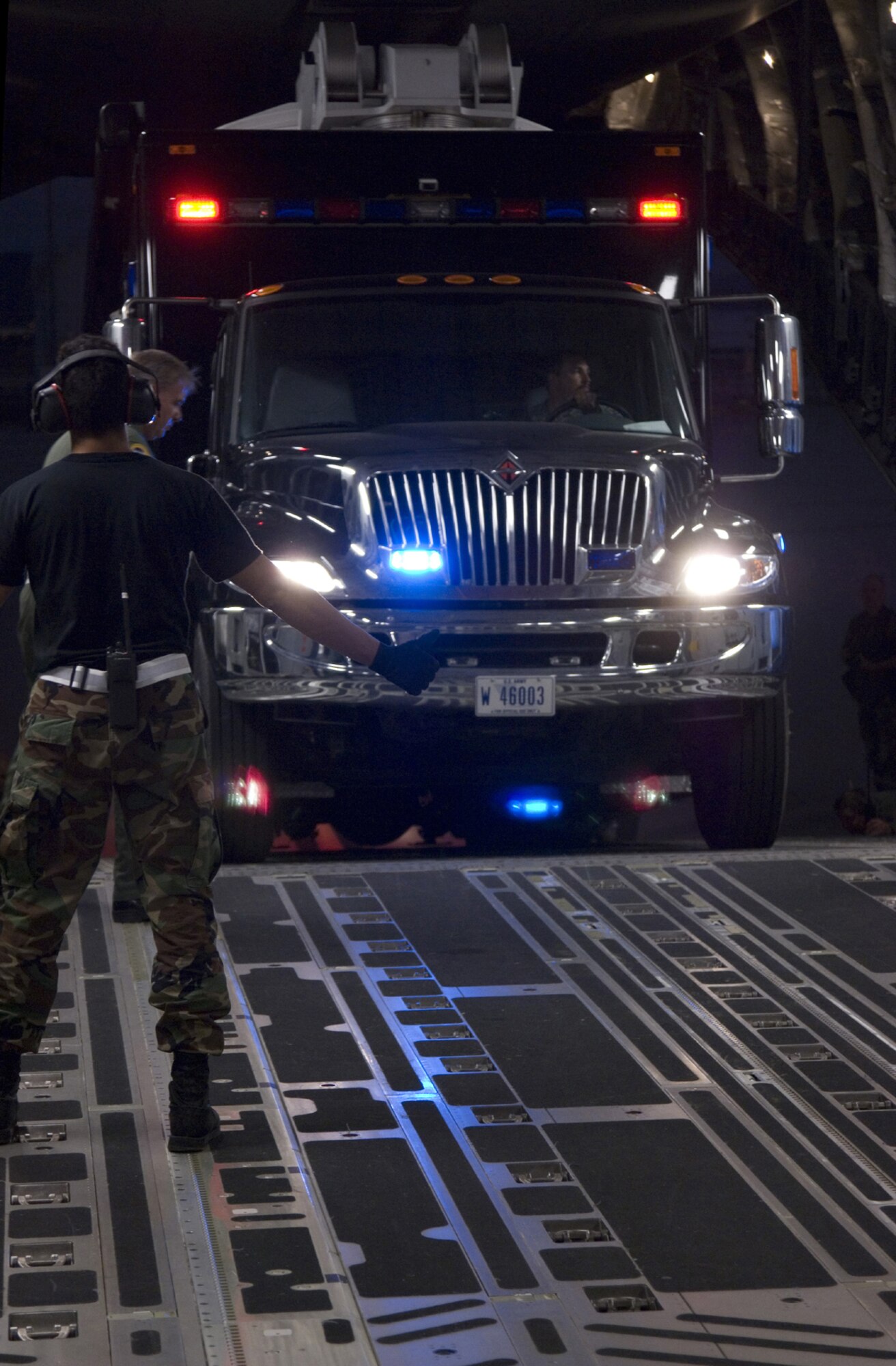 U.S. Army equipment is unloaded from an Air Force C-17 Globemaster III aircraft from the 452nd Air Mobility Wing at March Air Force Base, Calif., Oct. 24, 2007. The equipment is part of a federal support package used to assist federal, state and local agencies responding to the California wildfires. (U.S. Navy photo/Chief Mass Communication Specialist Michael Strand)