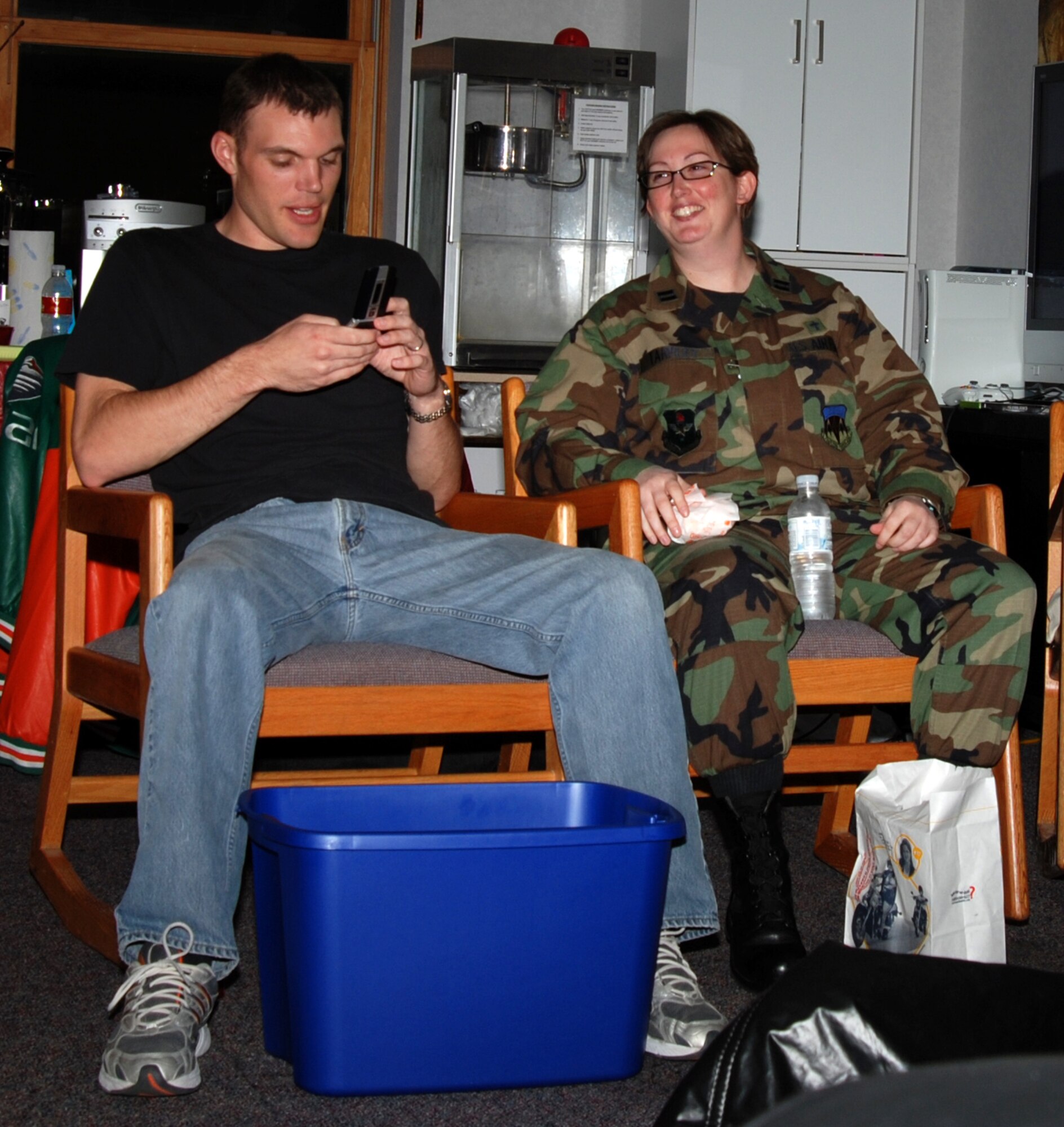 MCCONNELL AIR FORCE BASE, Kan. – Chaplain (Capt.) Sarah Tarpley, Protestant Chaplain, is temporarily assigned here filling in for Chaplain (Capt.) Kevin Hudson while deployed.  Chaplain Tarpley speaks with Airman 1st Class David Neff, 22nd Maintenance Squadron, who assist with activities at the LOFT, a program ran by the chapel.  (Photo by Staff Sgt. Ronald Lafosse II)