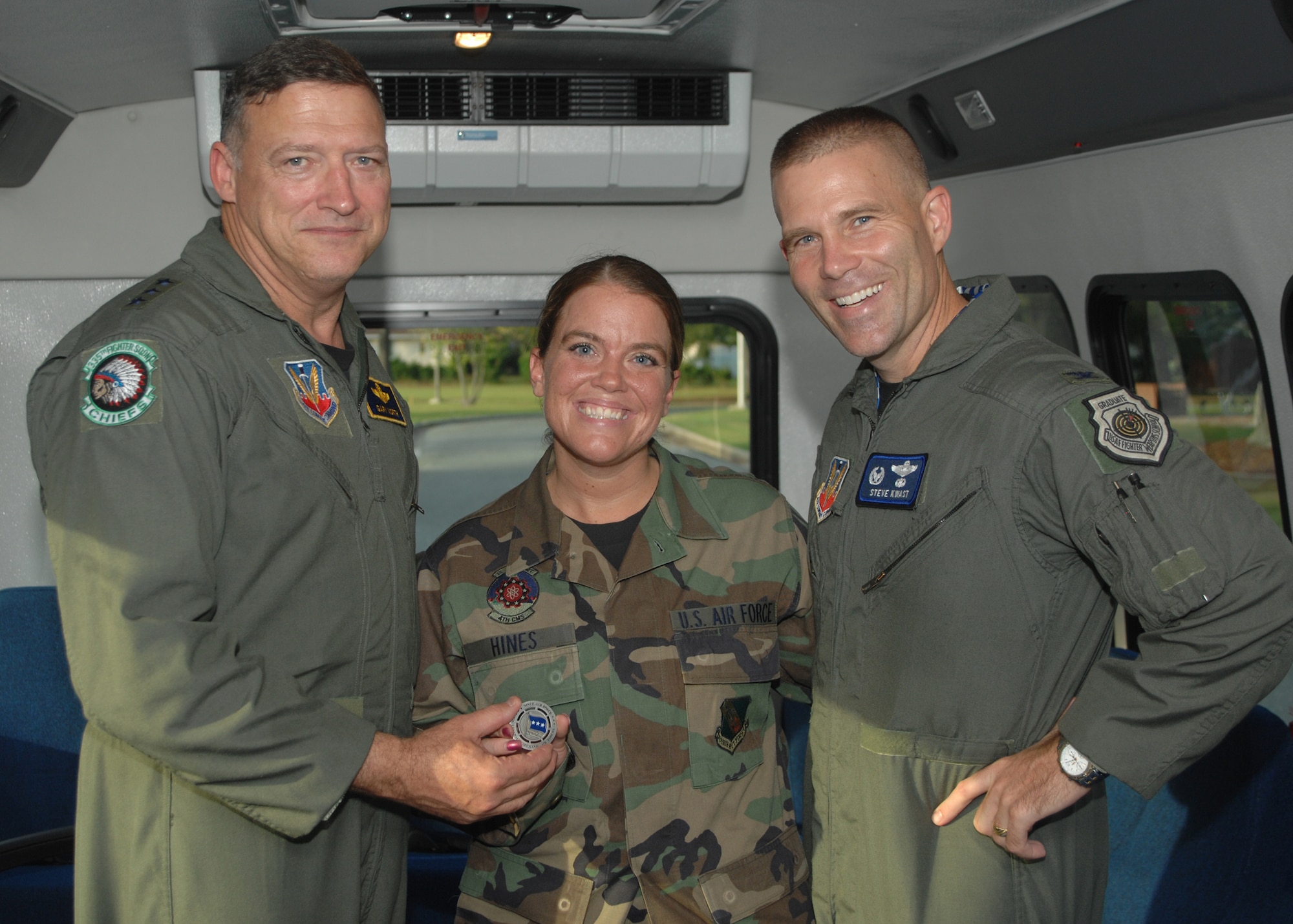 SEYMOUR JOHNSON AIR FORCE BASE, N.C. - Lieutenant General Gary L. North, Commander, 9th Air Force, presents Staff Sergeant Stacey Hines, 4th Fighter Wing, Protocol, with the 9th Air Force Commander?s coin on October 19th, 2007. Lieutenant General North is the Commander of the 9th Air Force and U.S. Central Command Air Forces. (U.S. Air Force photo by A1C Jonathon Williams)(released)