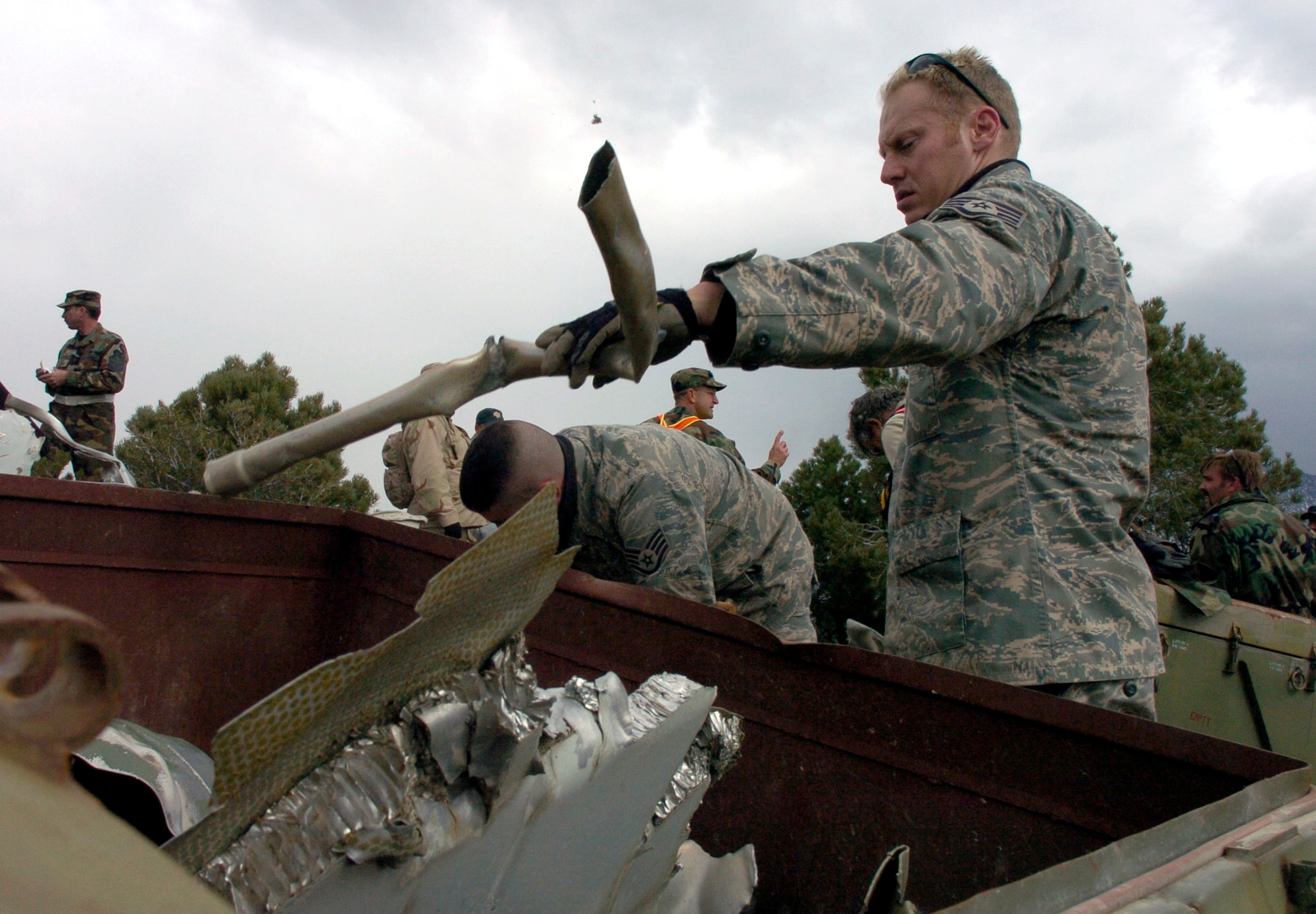 Staff Sgt. Benjamin Wilhelm verifies that the remains of an F-4 Phantom, that crashed nearly 30 years ago, are safe for handling Oct. 17. The aircraft crashed in the Deep Creek Mountains that span the Utah-Nevada border. Sergeant Wilhelm is an explosive ordnance disposal technician with the 775th Civil Engineer Squadron at Hill Air Force Base, Utah. (U.S. Air Force photo/Airman 1st Class Clayton Murray)