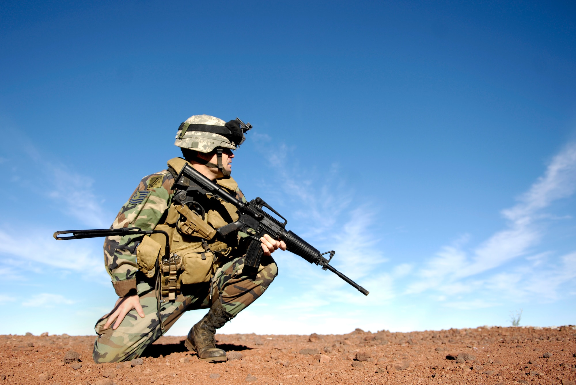 Tech. Sgt. Rick Setlock gives instructions on setting up and securing an evacuation landing zone during training Oct. 23, 2007 at the Pohakuloa Training Area on the big island of Hawaii. TSgt. Setlock is a tactical air control party member from the 25th Air Support Operations Squadron, Wheeler Army Airfield, Hawaii. The TACPs are training as part of the Koa Lighting exercise where bombers fly from Guam and practice their targeting. Currently four B-2 Spirit bombers are at Andersen Air Force Base, Guam, as part of the Continuous Bomber Presence mission.  Rotational bomber deployments to Guam help maintain stability and security in the region while allowing stateside-based units to become familiar with operating in the Pacific theater.  (U.S. Air Force photo/Tech. Sgt. Shane A. Cuomo)