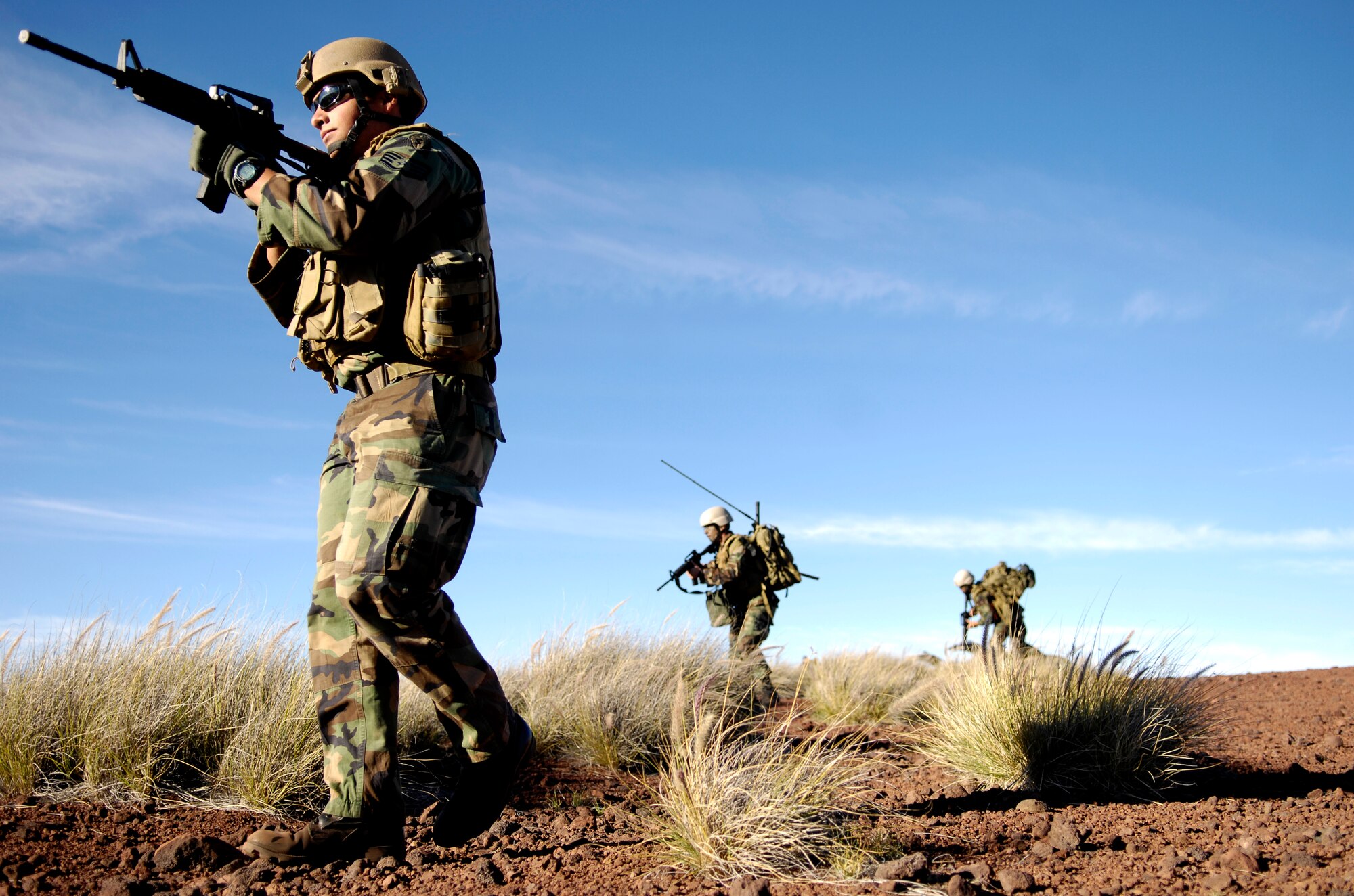 Staff Sgt. George Earhart takes point while training his Airmen on patrol tactics Oct. 23, 2007 at the Pohakuloa Training Area on the big island of Hawaii. The Airmen are tactical air control party members from the 25th Air Support Operations Squadron, Wheeler Army Airfield, Hawaii. The TACPs are training as part of the Koa Lighting exercise where bombers fly from Guam and practice their targeting.  Currently four B-2 Spirit bombers are at Andersen Air Force Base, Guam, as part of the Continuous Bomber Presence mission.  Rotational bomber deployments to Guam help maintain stability and security in the region while allowing stateside-based units to become familiar with operating in the Pacific theater.   (U.S. Air Force photo/Tech. Sgt. Shane A. Cuomo)