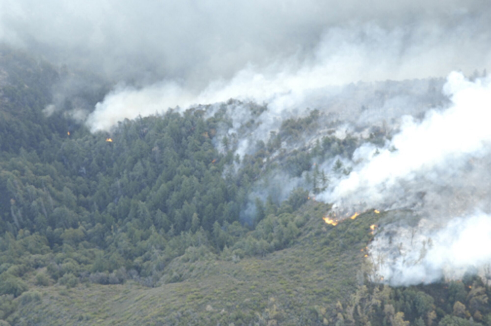 A wildfire continues to burn in North San Diego County, Calif., Oct. 24, 2007. Air Force reservists from the 302nd Airlift Wing, Peterson Air Force Base, Colo., are participating in the Southern California firefighting effort. (U.S. Air Force photo/Tech. Sgt. Roy A. Santana)