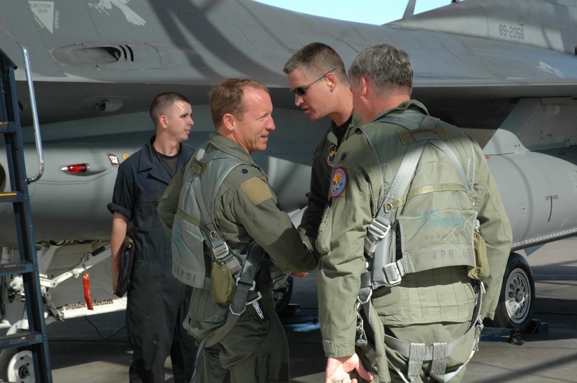 Lt. Col. Jay Paulus, 301st Fighter Squadron commander, receives congratulations from Lt. Col. Jeffrey Lovelace, 63rd Fighter Squadron commander, and Lt. Col. John Wynne, 301st Fighter Squadron director of operations, after obtaining his 4,000th flying hour in the F-16 on Oct. 24. According to Lockheed-Martin statistics, Colonel Paulus is the 22nd Air Force F-16 pilot to achieve this status. Reserve instructor pilots in the 301st FS fly 56th Fighter Wing F-16s to train active-duty student pilots. (U.S. Air Force photo/Tech. Sgt. Susan Stout)

 
