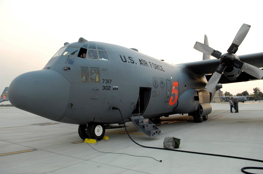 C-130 Hercules Modular Airborne Firefighting System aircraft No. 5, or MAFFS 5, sits on the flightline at Channel Islands Air National Guard Station, Calif., after deploying 3,000 gallons of fire retardant over the Poomacha fire Oct. 24 in North San Diego County, Calif. The C-130 and crew are assigned to the 302nd Airlift Wing from Peterson Air Force Base, Colo. Air Force Reserve Command officials sent two of its designated firefighting C-130H3 aircraft to help battle the raging wildfires in Southern California. (U.S. Air Force photo/Tech. Sgt. Roy. A. Santana) 
