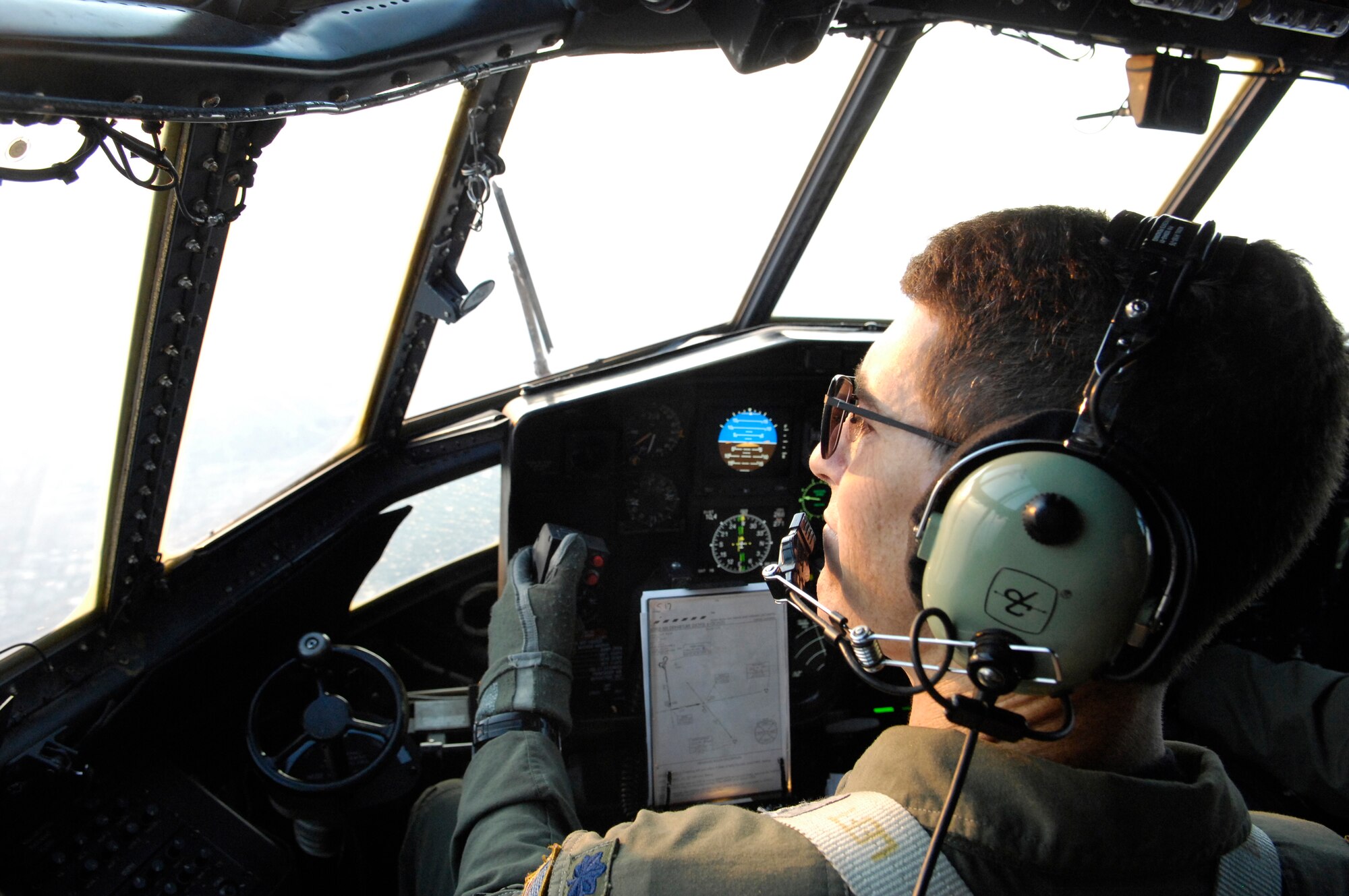 Lt. Col. Ted Treffeisen is part of the C-130 Hercules aircrew deploying 3,000 gallons of fire retardant over the Poomacha fire Oct. 24 in North San Diego County, Calif. The C-130 and crew are assigned to the 302nd Airlift Wing from Peterson Air Force Base, Colo. The aircraft launched from Channel Islands Air National Guard Station, Calif. Air Force Reserve Command officials sent two of its designated firefighting C-130H3 aircraft to help battle the raging wildfires in Southern California. (U.S. Air Force photo/Tech. Sgt. Roy. A. Santana) 
