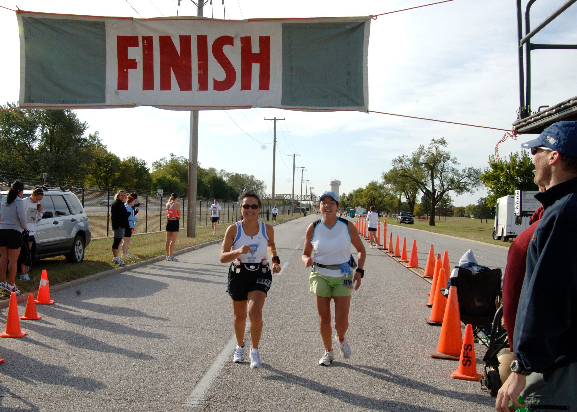 MCCONNELL AIR FORCE BASE, Kan. -- Two runners finish the 13 mile mark signifying the end the Wichita half marathon at McConnell, Oct. 21.  Ten miles of the half marathon and full 26.2 mile marathon were ran through the base. (Photo by Airman 1st Class Justin Shelton)