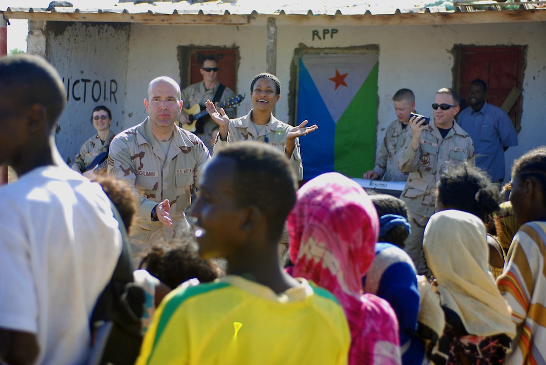 The members of the U.S. Central Command Air Forces' Expeditionary Band Live Round play a series of pop and classic rock songs for villagers Oct. 23 in Nagad, Djibouti. The band is touring Djibouti to perform a series of morale and community outreach concerts. (U.S. Army photo/Sgt. Charles Siler) 
