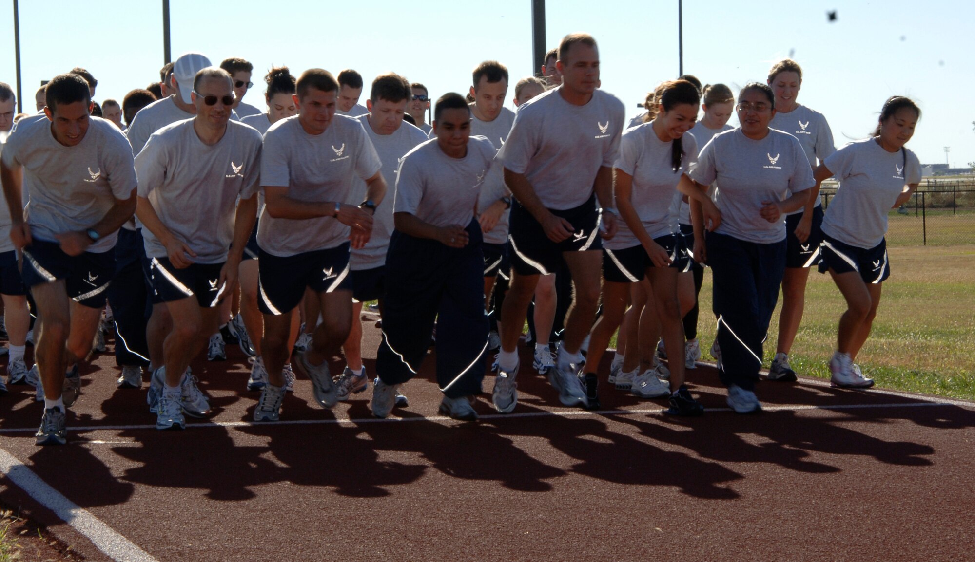 MCCONNELL AIR FORCE BASE, Kan. -- Team McConnell members take off running at the staring line at the Combined Federal Campaign CFC 5K Fun Run, Oct. 19. Team McConnell members raised $1,740 towards the campaign. (Photo by Airman 1st Class Roy Lynch III)