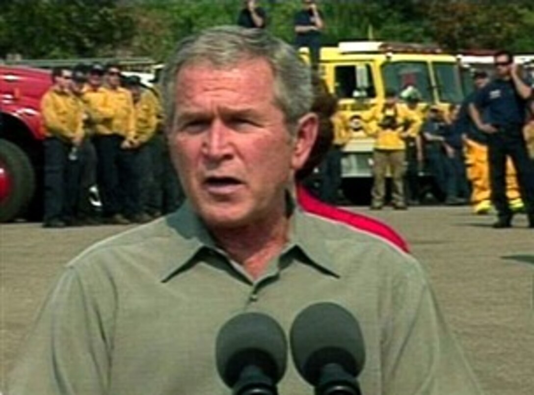 President Bush flew to California for a first-hand look at the damage and destruction caused by wildfires that have ravaged San Diego and surrounding areas, and to meet with firefighters battling the blazes, Oct. 25, 2007.  