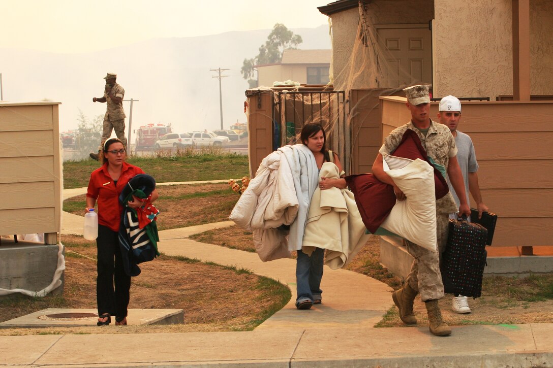 Oct. 24. Fires on Marine Corps Base Camp Pendleton, Calif. cause most of the Marines and Sailors, along with their families to evacuate their homes and work places.::r::::n::
