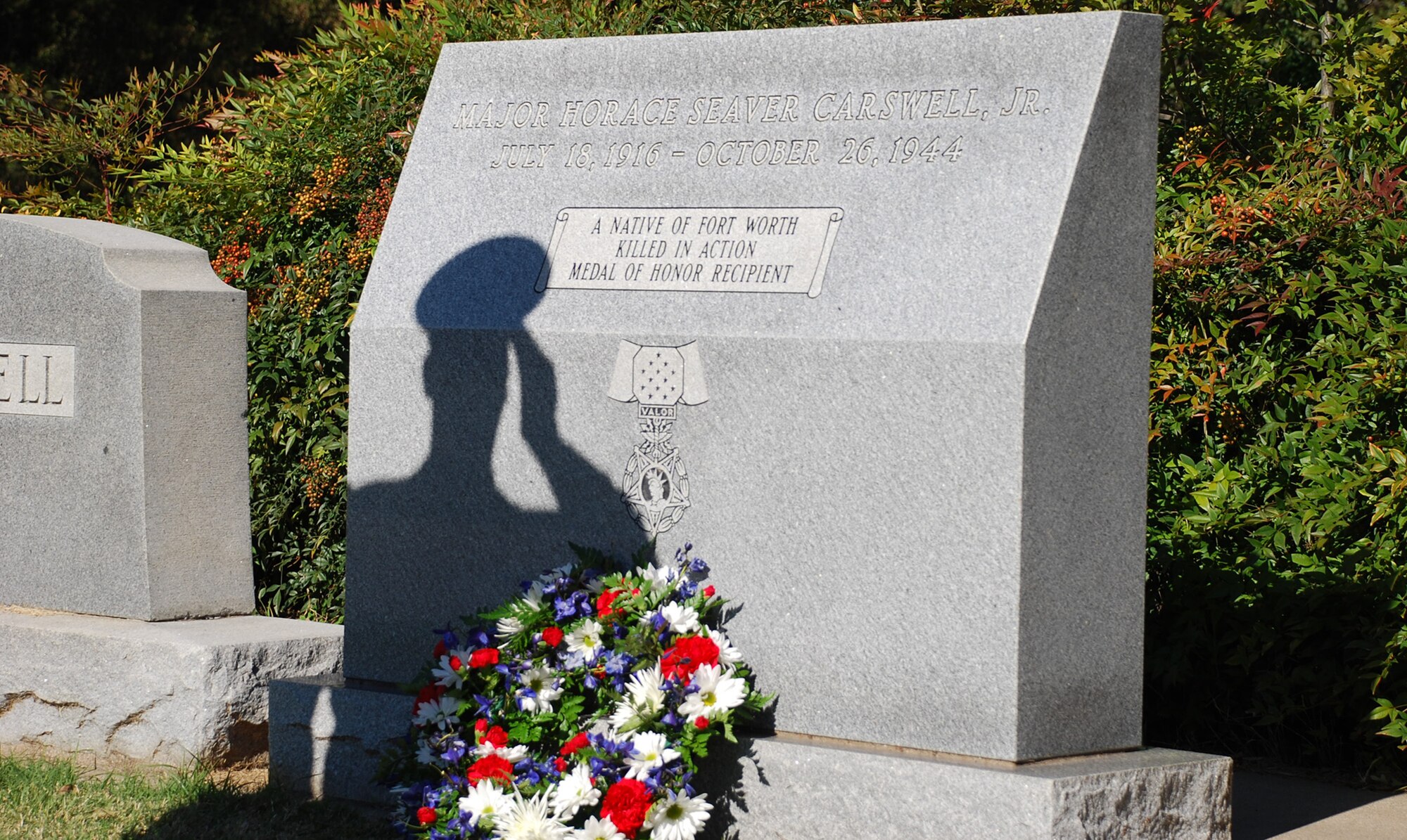 Staff Sgt. Marc Coopershedfield, 301st Fighter Wing Honor Guard member, lays a wreath on the resting place of Maj. Horace Carswell on the anniversary of this death to remember his sacrfices and pay homage. Major Carswell was shot down over China on Oct. 26, 1944, and the base, in Fort Worth, Texas, was named after the major in 1948.  The base now called Naval Air Station Joint Reserve Base Fort Worth Carswell Field, Texas,  is home to all branches of the U.S. armed forces. (U.S. Air Force Photo/Tech. Sgt. Julie Briden-Garcia) 