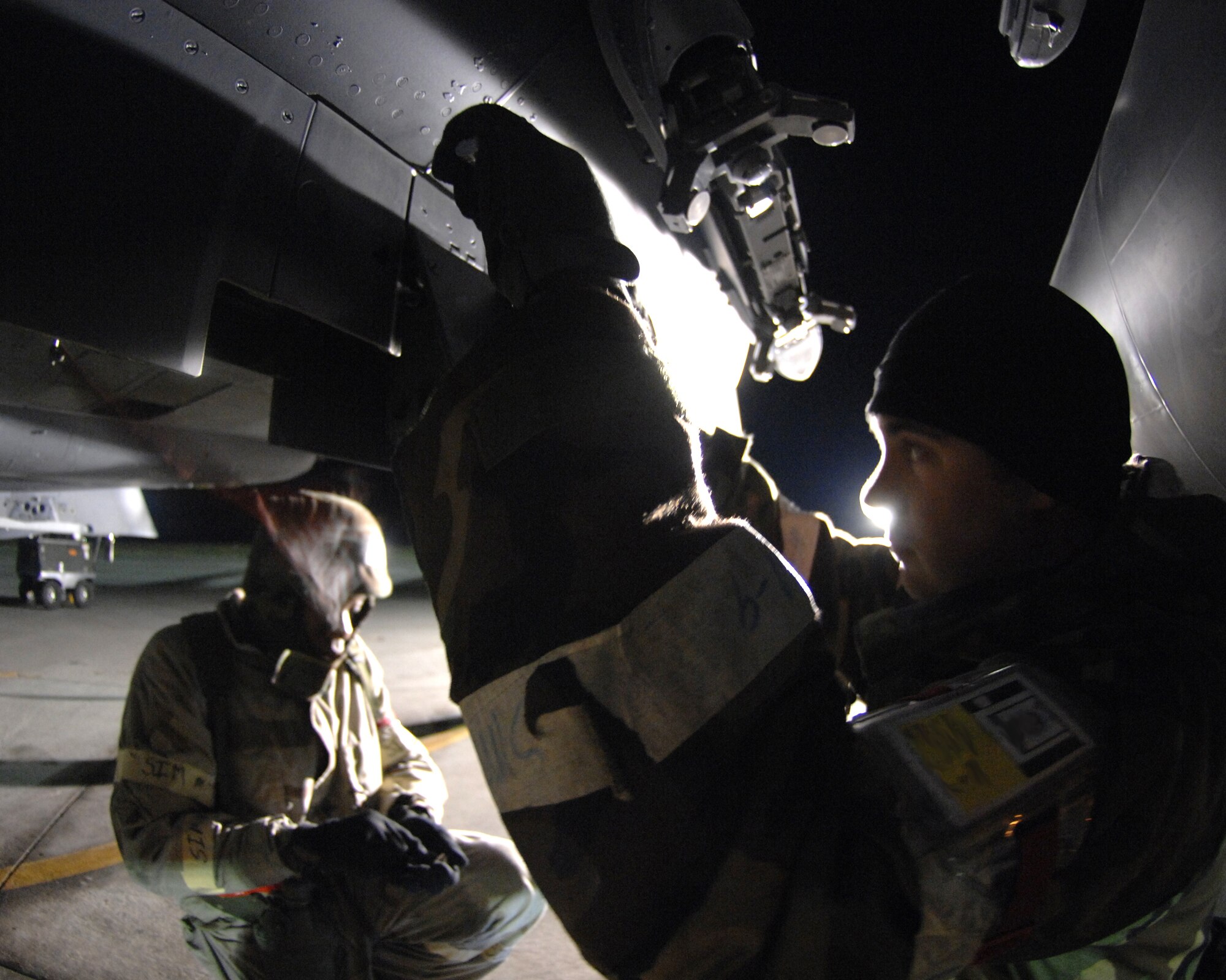 MOUNTAIN HOME AIR FORCE BASE, Idaho—Staff Sgt. Dane Sherin, a weapons team Chief from the 389th Aircraft Maintenance Unit, works on an F-15E Strike Eagle during the operational readiness exercise here, Oct 24.  The 389th Fighter Squadron is participating in Exercise Sharpshooter 08-01 to prepare for the operational readiness inspection in March 2008. (U.S. Air Force photo by Stephany Miller)
