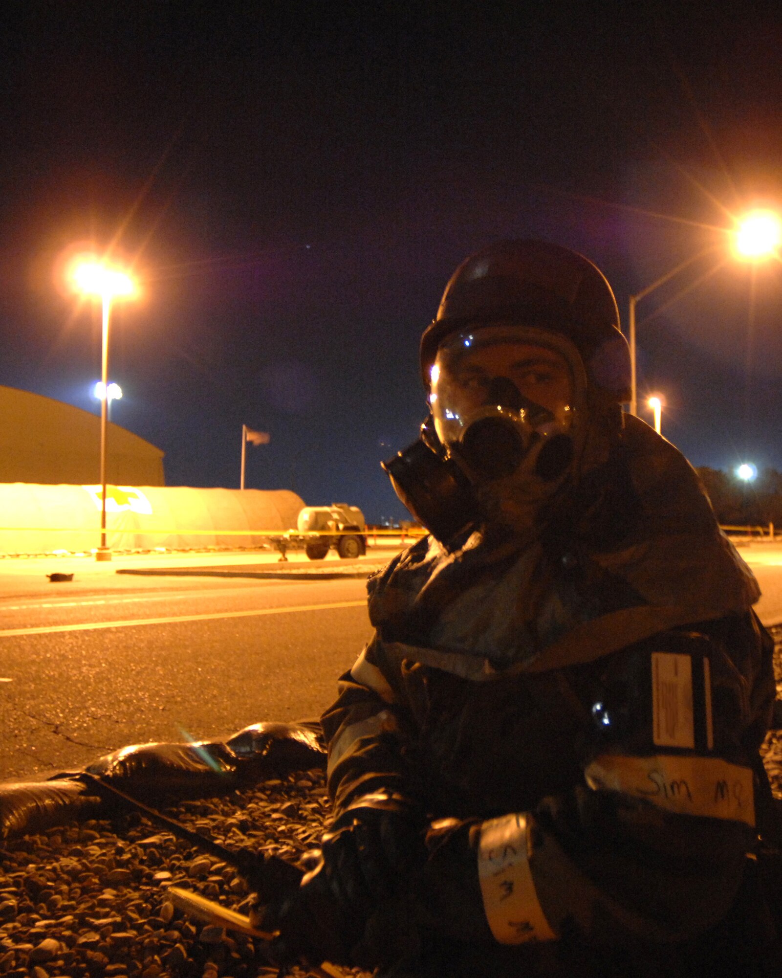 MOUNTAIN HOME AIR FORCE BASE, Idaho -- Staff Sgt. Rodney Ivey, 366th Fighter Wing Public Affairs, sits inside a simulated bunker during alarm blue while participating in the Phase II portion of the deployment exercise here Oct. 24.  The 366th Public Affairs office is participating in Exercise Sharpshooter 08-01 deployment exercise to prepare for the operational readiness inspection in March 2008. (U.S. Air Force photo by Airman 1st Class Stephany Miller)