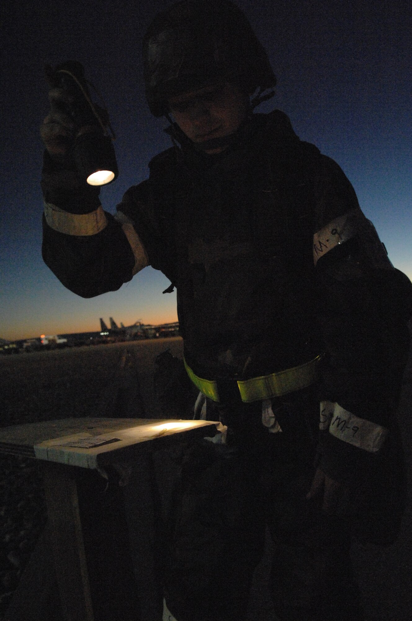 MOUNTAIN HOME AIR FORCE BASE, Idaho – Airman Joshua McCusker, 366th Logistics Readiness Squadron, checks M-8 chemical detector paper during alarm green to ensure that contamination is not present during Exercise Sharpshooter 08-01, an operational readiness exercise. The 366th Fighter Wing is practicing for future potential combat scenarios and contingency operations. Units across the base are participating in the exercise to prepare personnel and equipment for the upcoming March 2008 Operational Readiness Inspection. (U.S. Air Force photo/ Staff Sgt. Kathy Parker)