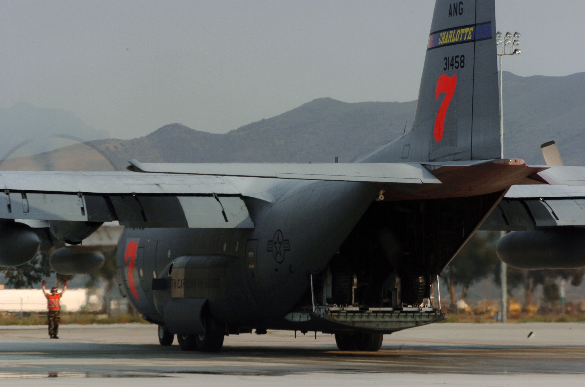 C-130 Hercules from the North Carolina Air National Guard's 145th Air Wing taxies on the flightline Oct. 25 at Naval Air Station Point Mugu, Calif. The aircraft is equipped with the Modular Airborne Firefighting System and is being used to fight wildfires in Southern California. (U.S. Air Force photo/Tech. Sgt. Brian E. Christiansen) 
