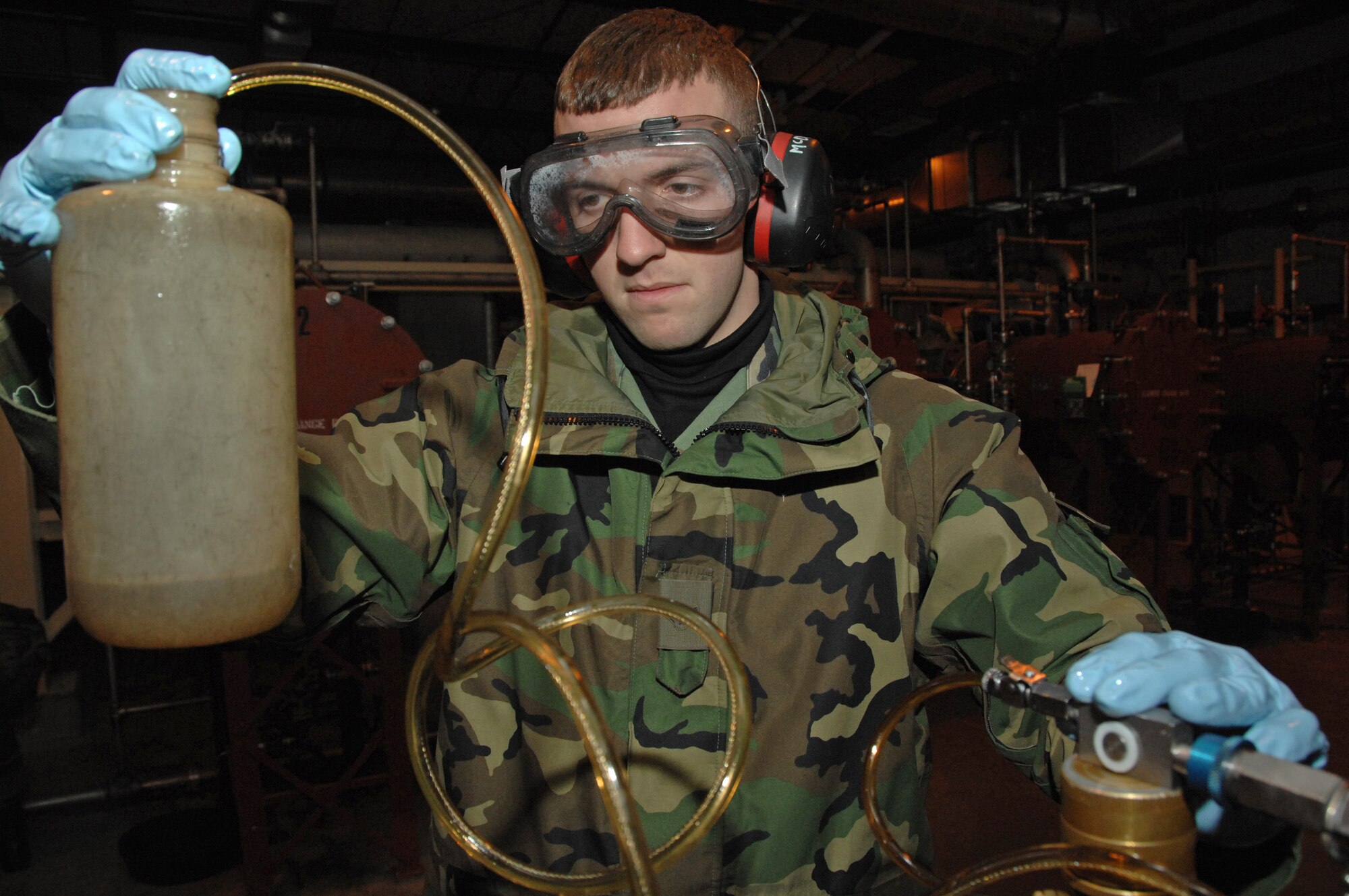 Airman 1st Class Sean McDonagh connects an inline sampler which is used to detect free water in fuel Oct. 24 at Eielson Air Force Base, Alaska. Making sure the fuel used by the aircraft at Eielson is always good to go, Airman McDonagh helps assure the process by constantly sampling the fuel lines and the trucks that distribute it to the aircraft. Airman McDonagh is a fuels laboratory technician assigned to the 354th Logistic Readiness Squadron. (U.S. Air Force photo/Airman 1st Class Christopher Griffin)