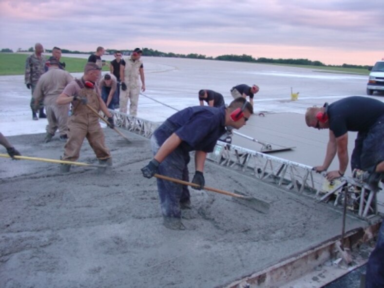 Airman from the 823rd RED HORSE Squadron repair a runway at Whiteman Air Force Base, MO on July 13, 2007. (U.S. Navy photo by Lieutenent JG Meskill)