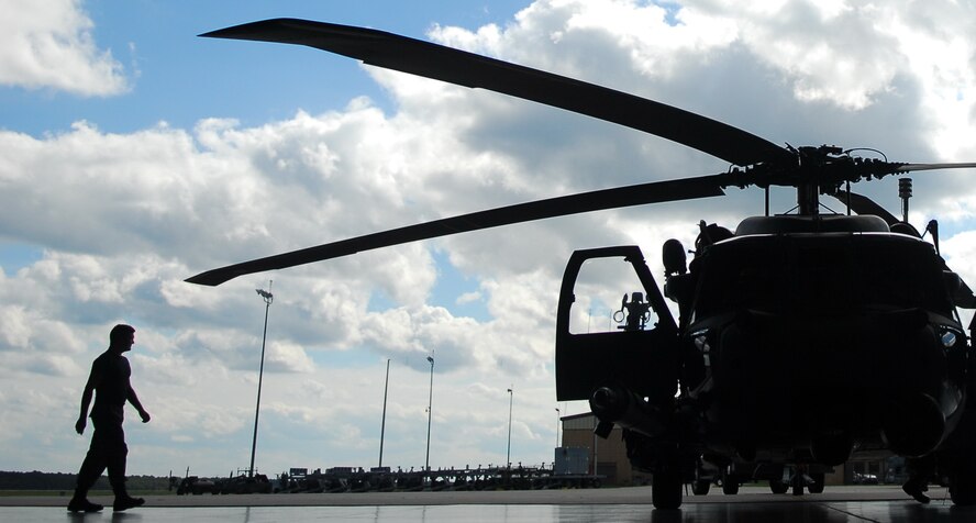 MOODY AIR FORCE BASE, Ga. -- Airman 1st Class Donald Baker, 723rd Aircraft Maintenance Squadron engine specialist, approaches an HH-60G Pave Hawk before it is towed into a maintenance hanger here Oct 25. The helicopter is designed for all-weather combat search and rescue. (U.S. Air Force photo by Tech. Sgt. Parker Gyokeres)