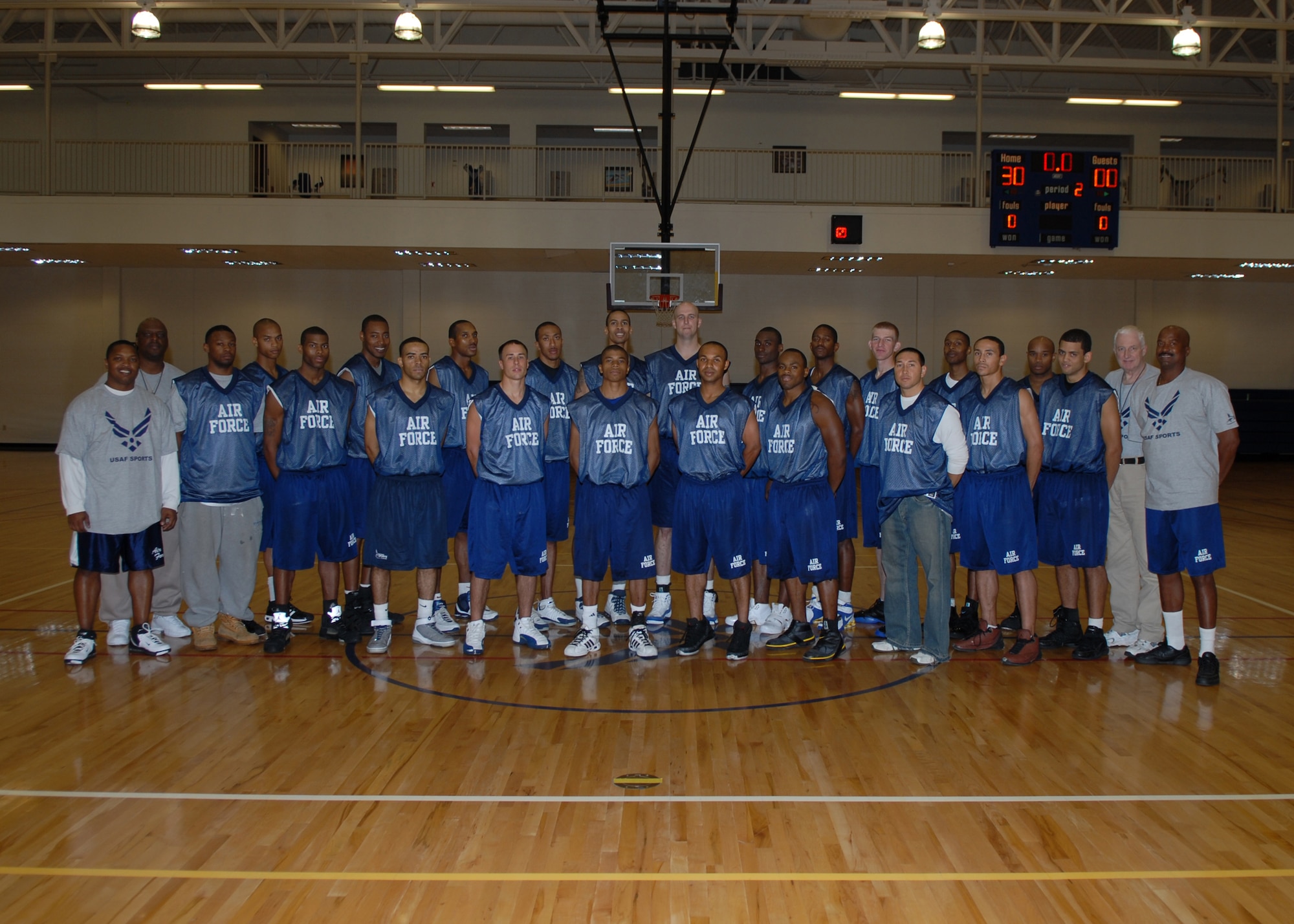 BUCKLEY AIR FORCE BASE, Colo. -- Players and coaches posed for a picture after practice at the men's Air Force basketball tryouts here Oct. 17. More than twenty Airmen are battling for 12 roster spots. The team's final exhibition game is Monday against the Fort Collins All-Stars. Final cuts will be made after the team breaks camp Wednesday. (Air Force photo by Airman 1st Class Randi Flaugh)