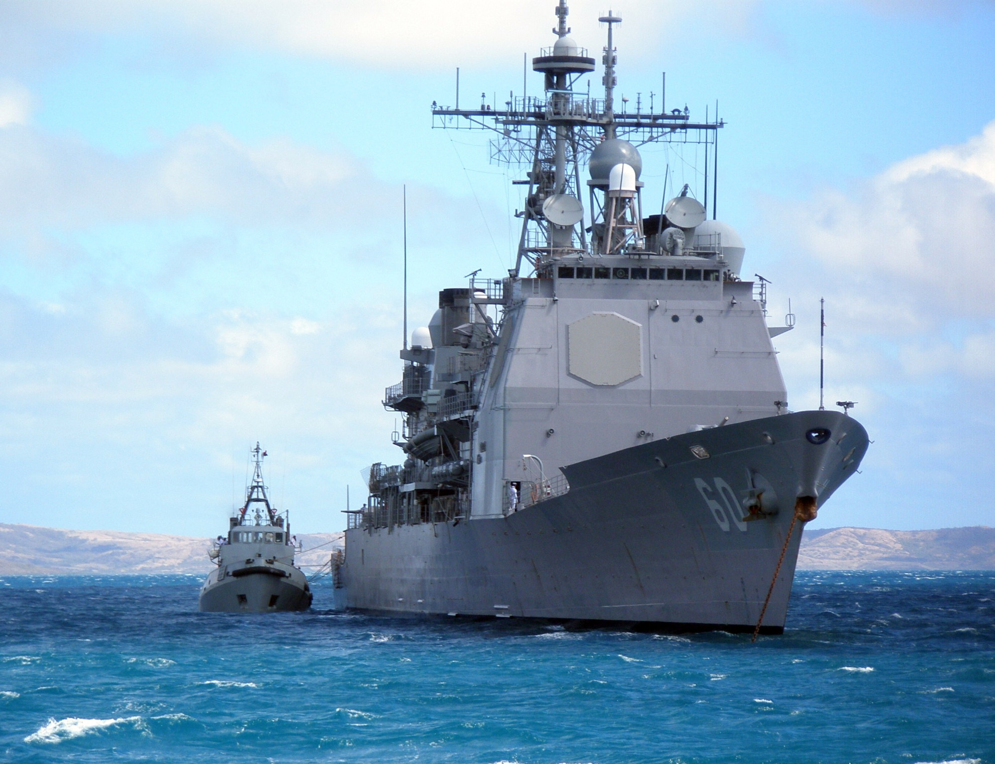 The USS Normandy, a Navy guided missile cruiser, anchors off the shore of Madagascar. Navy Chief Petty Officer Robert Orton served on a three-man advance team to the African island nation in September. A reservist, Chief Orton is also a personnel technician at the Air Reserve Personnel Center in Denver. (Courtesy photo)