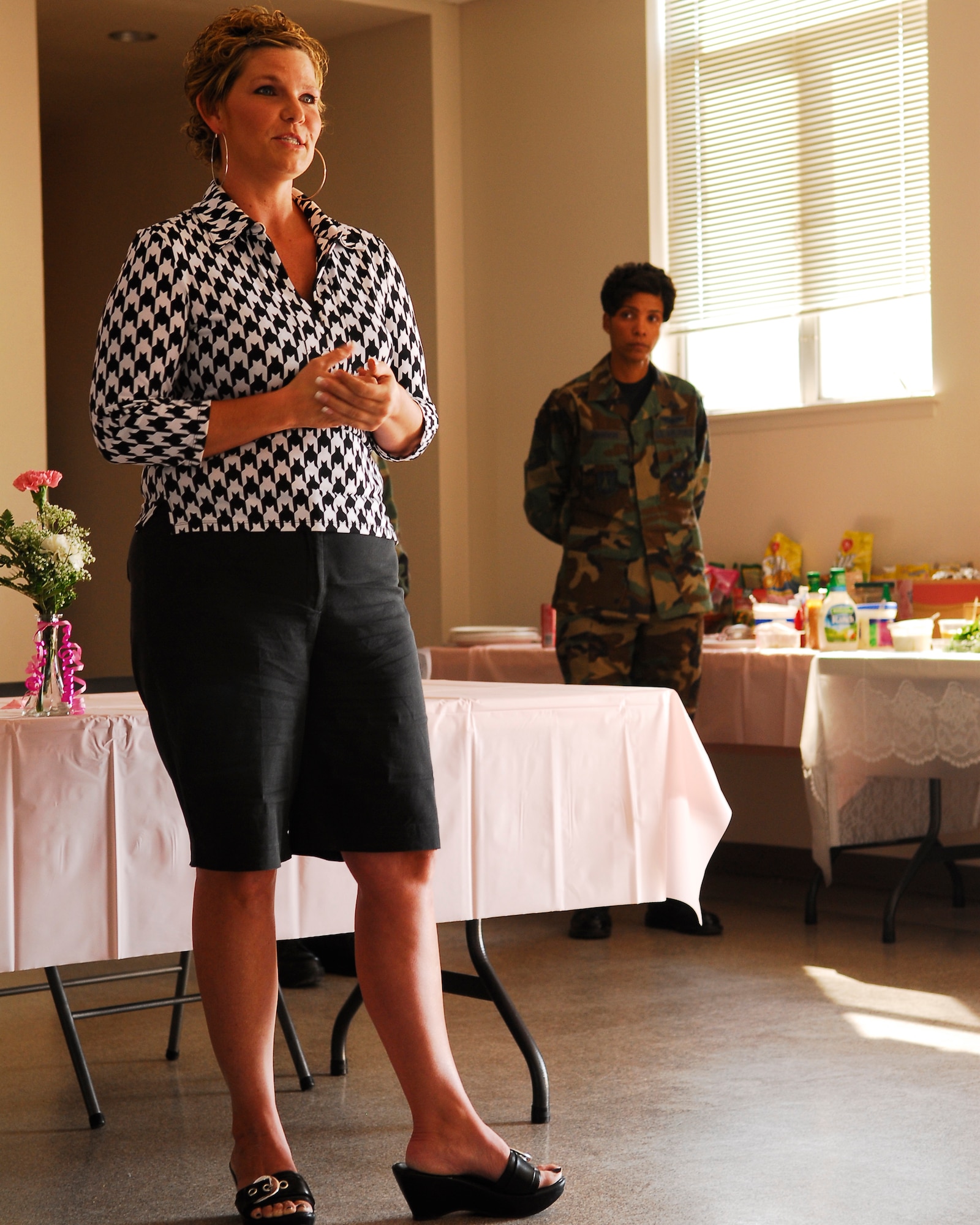 Kelli Watkins, a breast cancer patient, tells the story of her journey with coping with breast cancer during the Breast Cancer Awareness Seminar on Oct. 24 held at Chapel One on Vandenberg. The Breast Cancer Awareness Seminar was created to help educate and inform the population about breast cancer. (Photo by Airman 1st Class Ashley Reed)