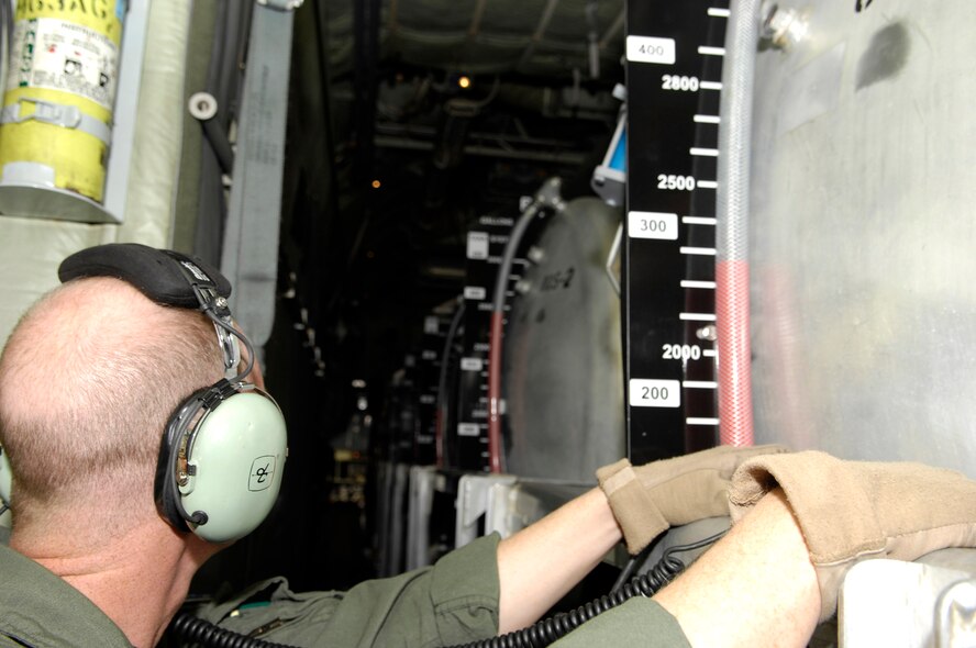 Master Sgt. Thomas Freeman monitors the fire retardant levels of the Modular Air Fire Fighting System on a C-130 Hercules as it prepares to launch Oct. 25 from Channel Islands Air National Guard Base, Calif.  Sergeant Freeman is assigned to the 302nd Airlift Wing from Peterson Air Force Base, Colo. Air Force Reserve Command and Air National Guard Airmen are participating in the Southern California firefighting effort. (U.S. Air Force photo/Tech. Sgt. Roy. A. Santana) 
