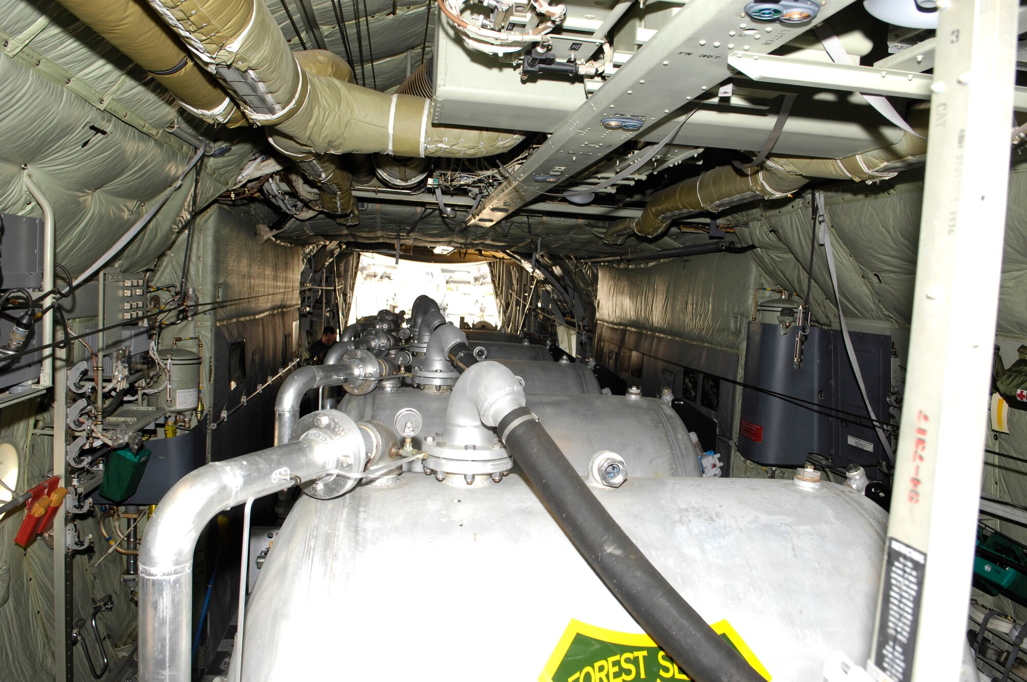 Inside a C-130 Hercules, a Modular Air Fire Fighting System is in place to help support firefighting efforts of the Southern California wildfires Oct. 25 at Channel Islands Air National Guard Base, Calif. Air Force Reserve Command and Air National Guard Airmen are participating in the Southern California firefighting effort. (U.S. Air Force photo/Tech. Sgt. Roy. A. Santana)
