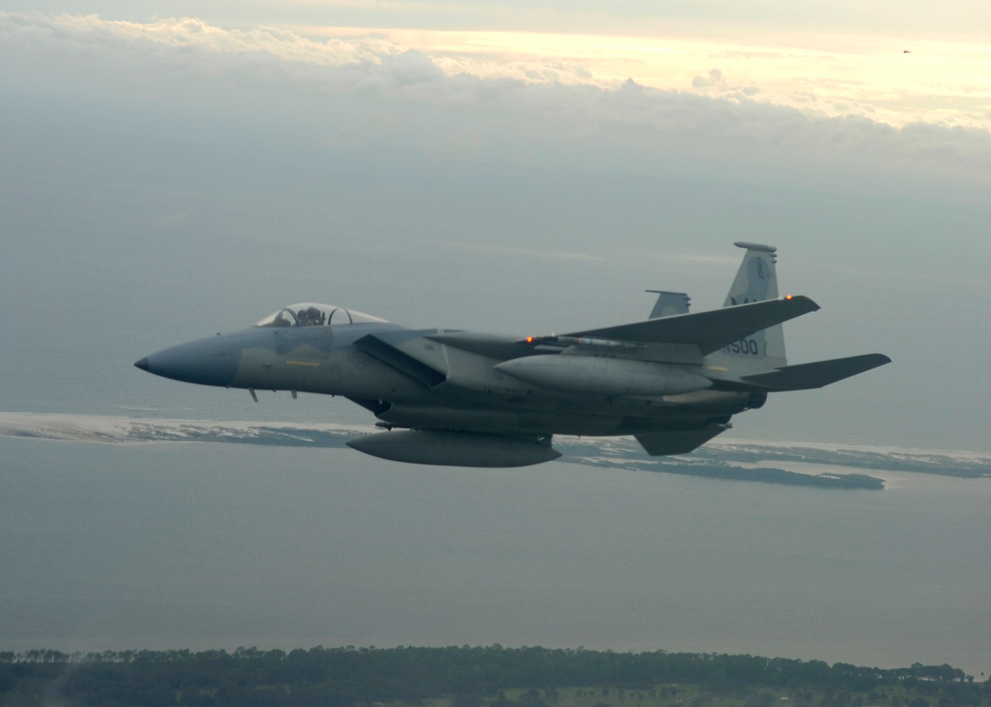 An F-15 Strike Eagle from Otis Air National Guard, Massachusetts flies over Florida’s Gulf Coast while participating in a Combat Archer exercise Oct. 16.  The 83rd Fighter Weapons Squadron, located at Tyndall Air Force Base Fla., hosted the guard unit for Combat Archer Oct. 15-18.  The exercise experienced some delays due to rough weather during the week.  Combat Archer is a weapons system evaluation that analyzes personnel and equipment to determine the effectiveness of the Air Force’s frontline air-to-air combat capability.  This program is run exclusively by the 83rd FWS.  (Air Force photo by Capt. Jeffrey Barnes.)