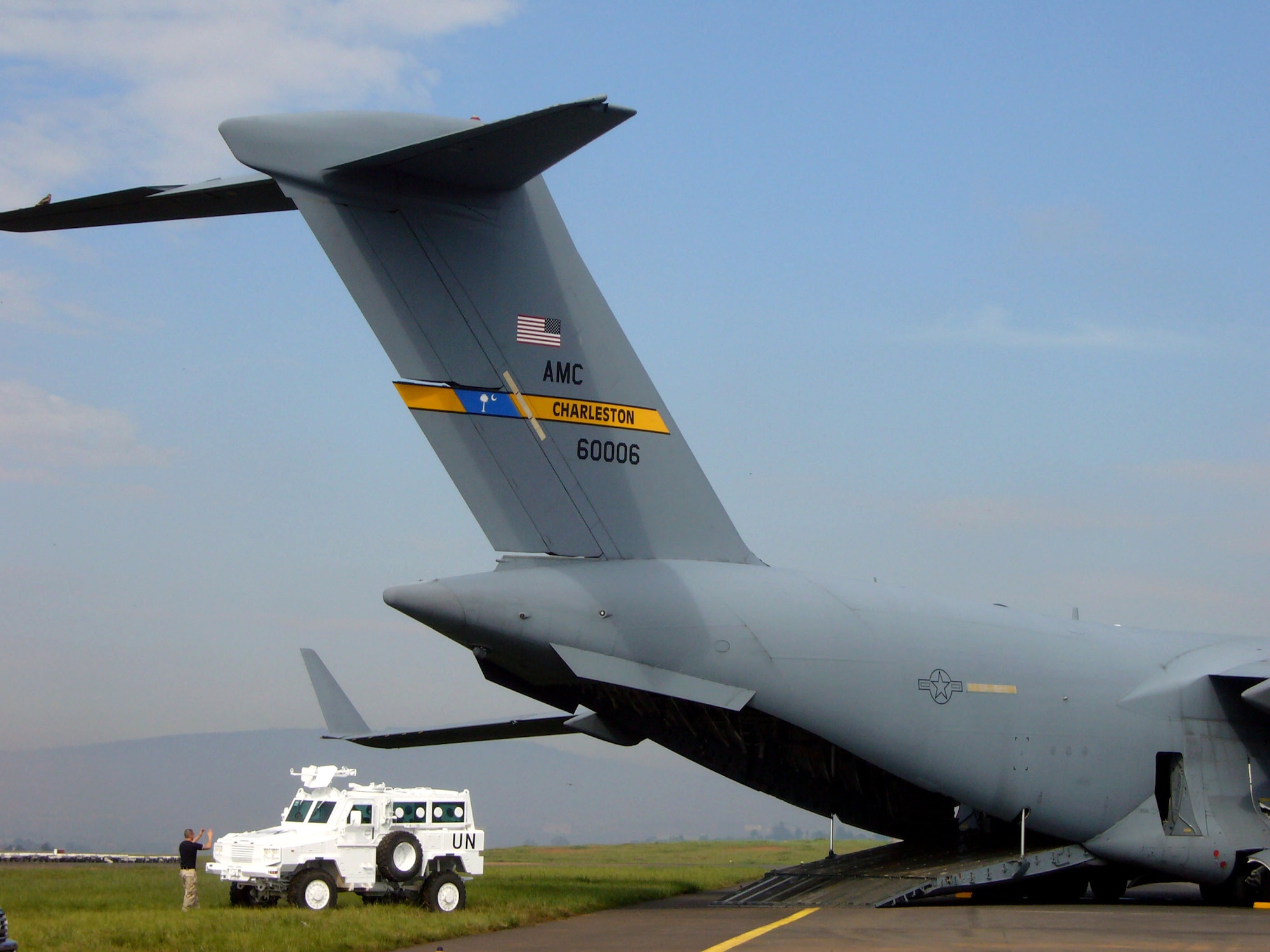 Airmen from the 786th Air Expeditionary Squadron load United Nations armored personnel carriers into C-17 Globemaster III en route to the Darfur region of Sudan Oct. 24 at Kigali International Airport in Kigali, Rwanda. (U.S. Air Force photo/Capt. Erin Dorrance) 