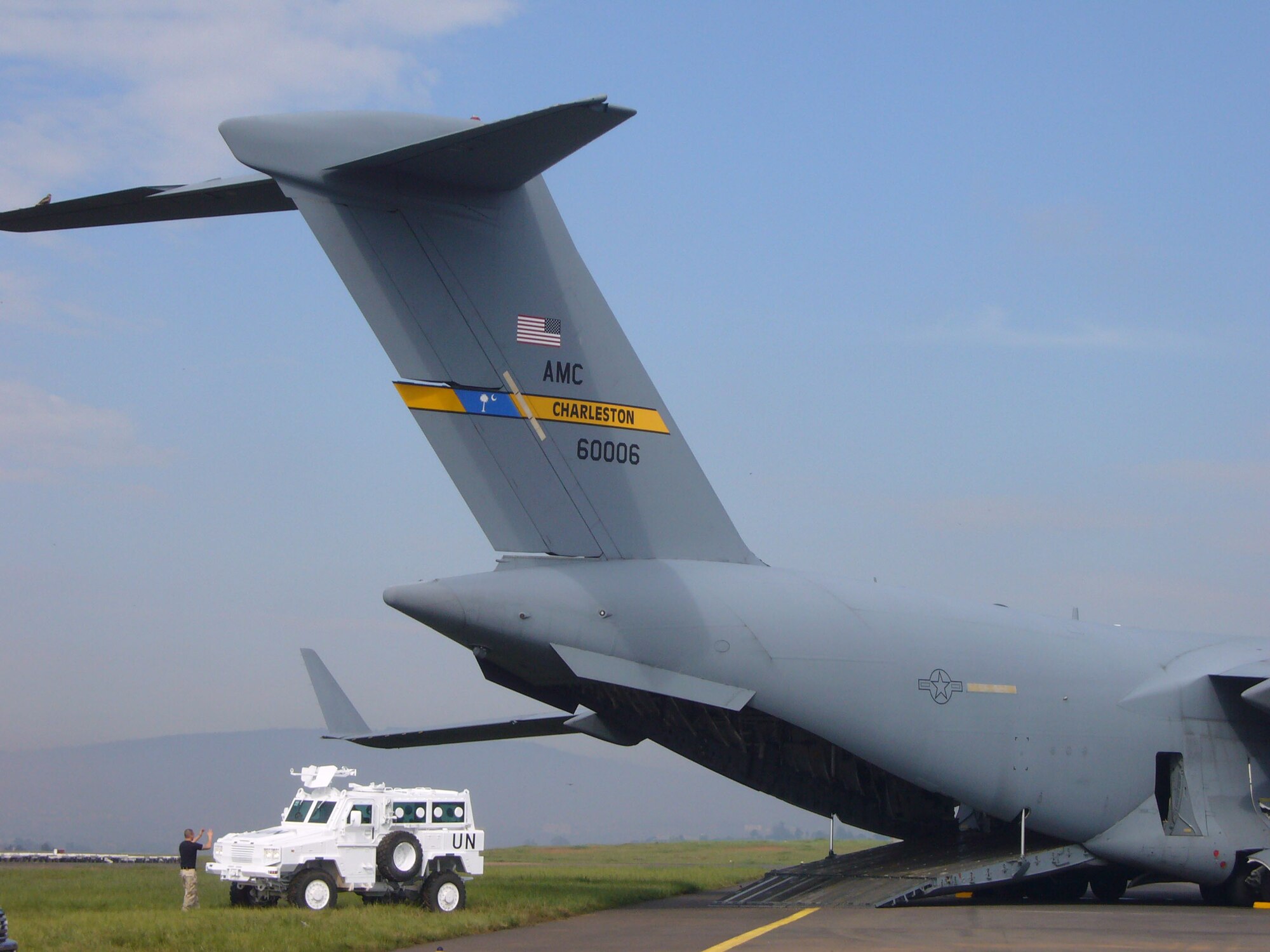 Airmen from the 786th Air Expeditionary Squadron loaded United Nations armored personnel carriers onto C-17s en route to the Darfur region of Sudan Oct. 24 at Kigali International Airport in Kigali, Rwanda .  

