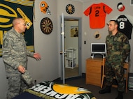 MINOT AIR FORCE BASE, N.D. -- Chief Master Sgt. Mark Clark, 5th Bomb Wing command chief master sergeant, inspects a dormitory room here Oct. 25. Chief Clark and other senior leaders were inspecting dorms for the room of the quarter award. Airman 1st Class Heater Schramek, 5 Maintenance Squadron, took first place; Airman 1st Class Dayna M. Behnke, 5th Maintenance Operations Squadron, took second place; and Airman 1st Class Theresa Kringen, 5th Civil Engineer Squadron, took third place. (U.S. Air Force photo by Airman 1st Class Sharida Bishop) 