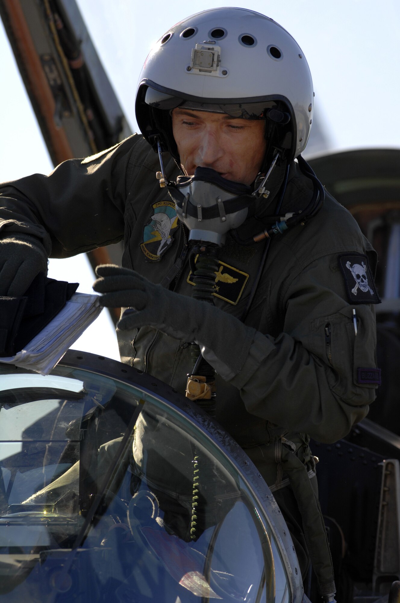 AVIANO AIR BASE, Italy-- Bulgarian air force pilot Capt. Victor Stoyanov Hristov climbs out of his MiG-29 after completing a combat training mission. Oct. 17, 2007.  More than 250 Airman from Aviano join with the Bulgarian air force to train together during Exercise RODOPI JAVELIN 2007 at Graf Ignatevio air force base, Bulgaria. 5-26 Oct, 2007.  (U.S. Air Force photo/Staff Sgt. Michael R. Holzworth)