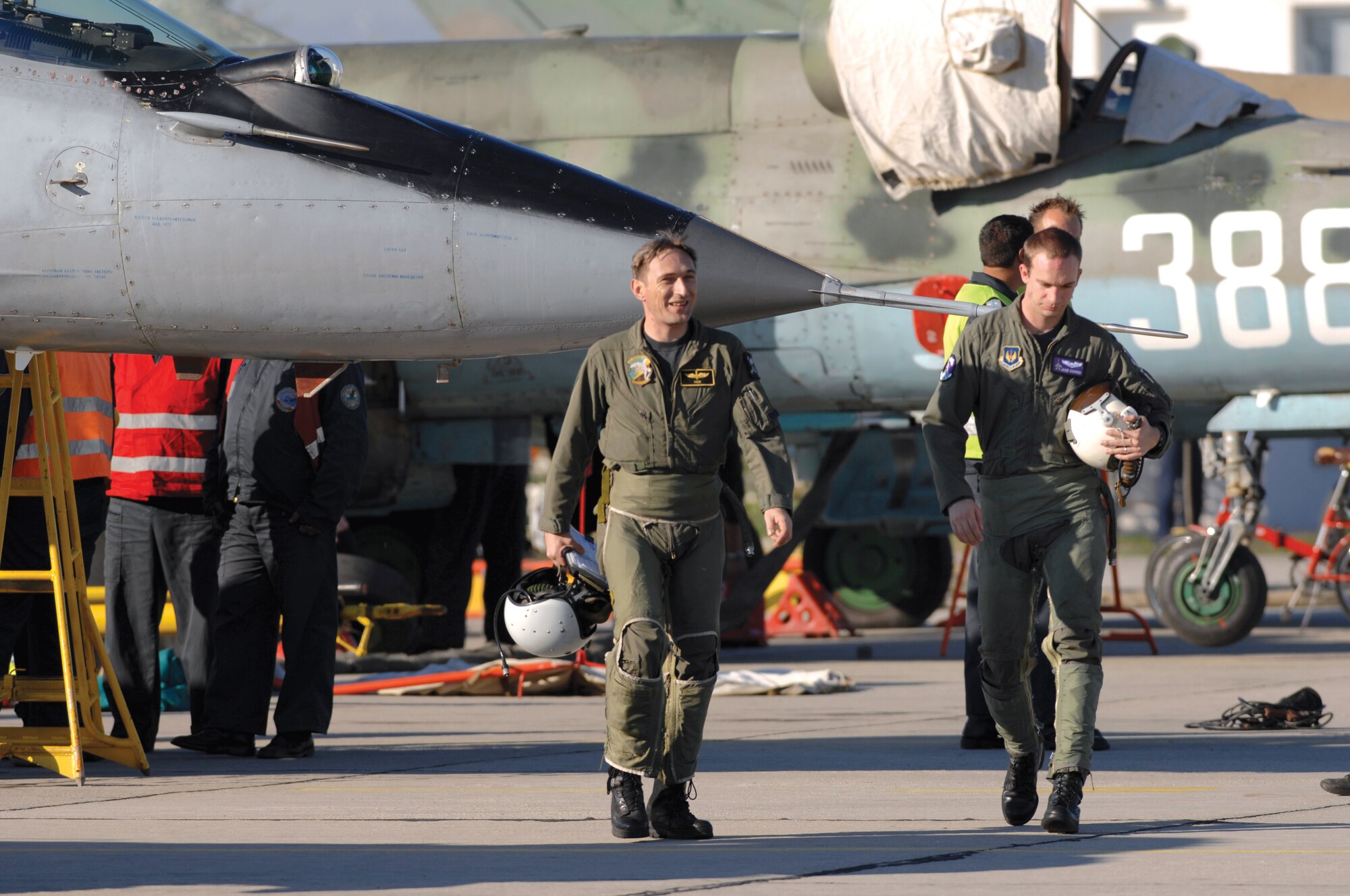 AVIANO AIR BASE, Italy--Capt. Victor Stoyanov Hristov, Bulgarian Air Force pilot, and 1st Lt. Jacob Conger, 510th Fighter Squadron pilot, walk back to the operations building after completing a combat familiarization training mission Oct. 18 during exercise RODOPI JAVELIN 2007 at Graf Ignatevio air force base. (U.S. Air Force photo/Staff Sgt. Michael R. Holzworth) 