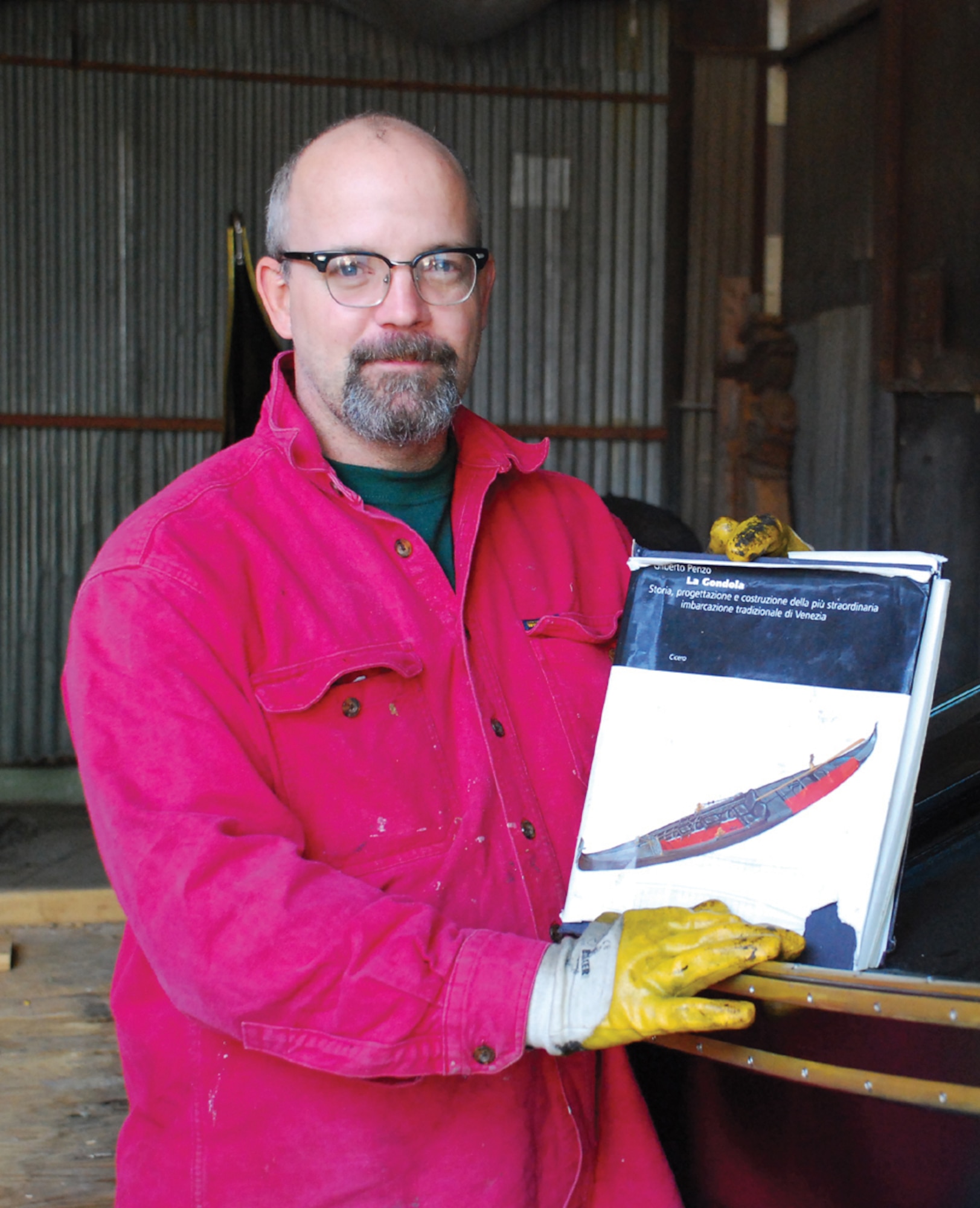 AVIANO AIR BASE, Italy--Craig Manley displays a Venetian gondola instructional book he used to build the gondola. (U.S. Air Force photo/Chrisinda Swede).